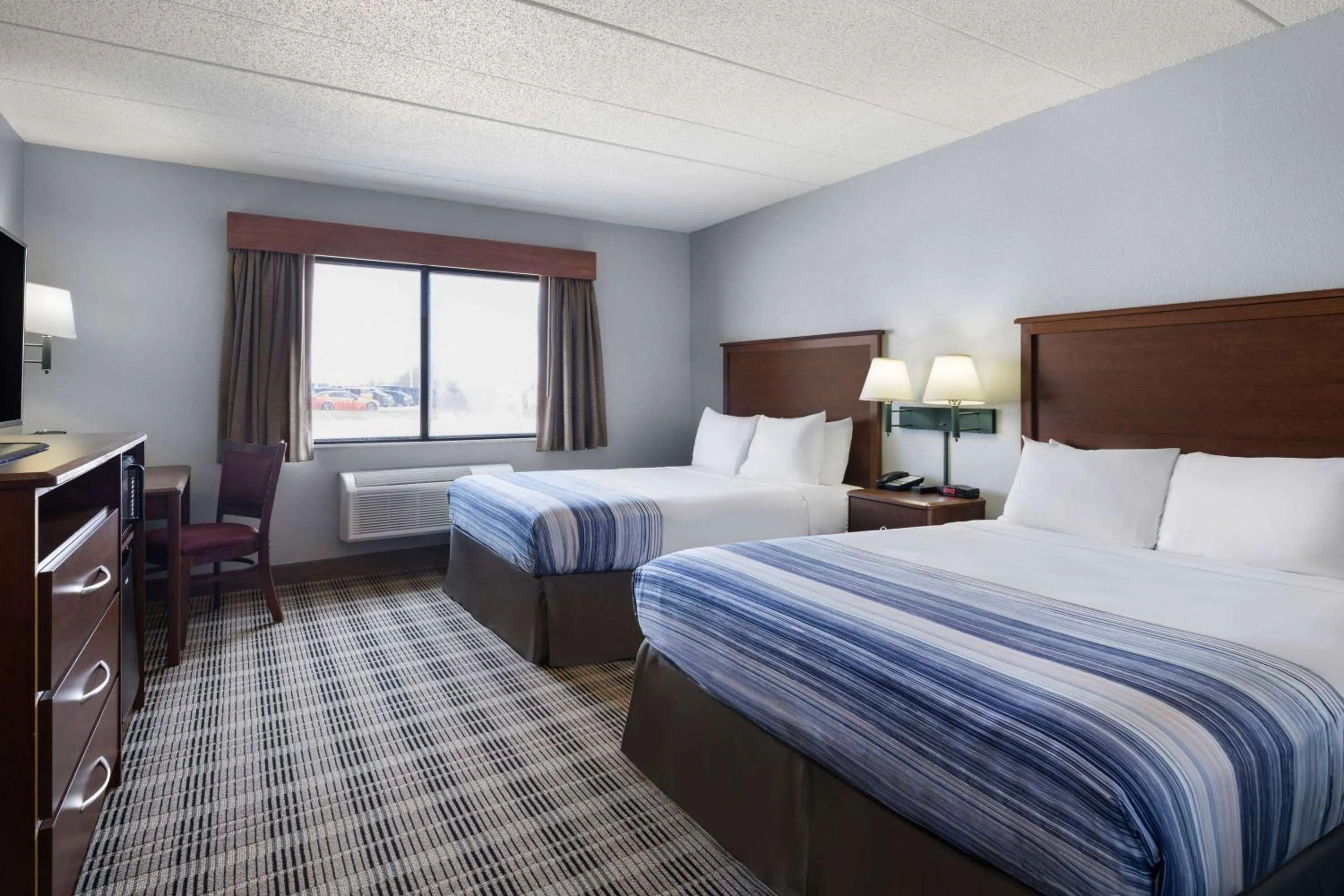 Photo of the whole room, Bed in AmericInn by Wyndham Stuart
