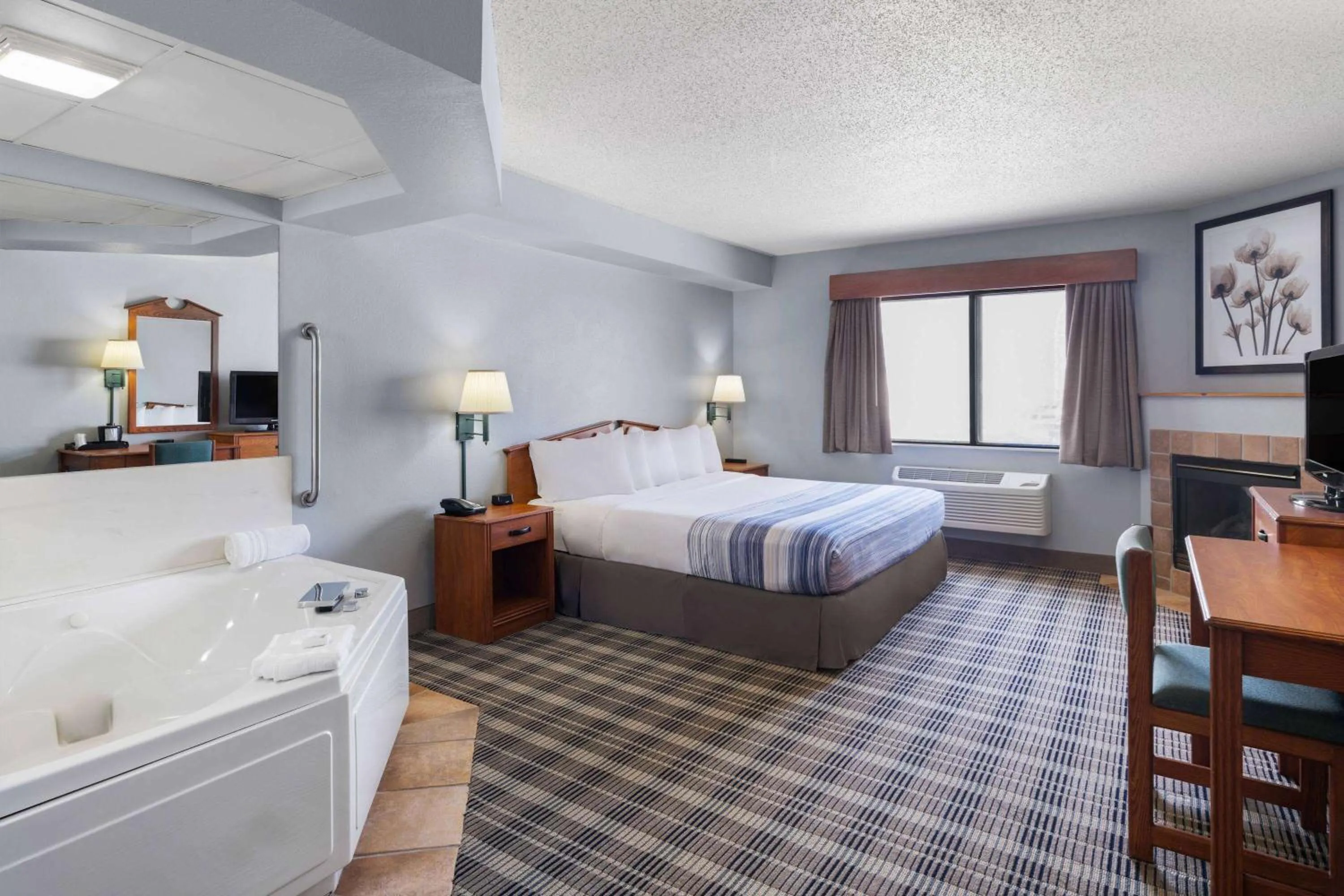 Photo of the whole room, Bed in AmericInn by Wyndham Stuart