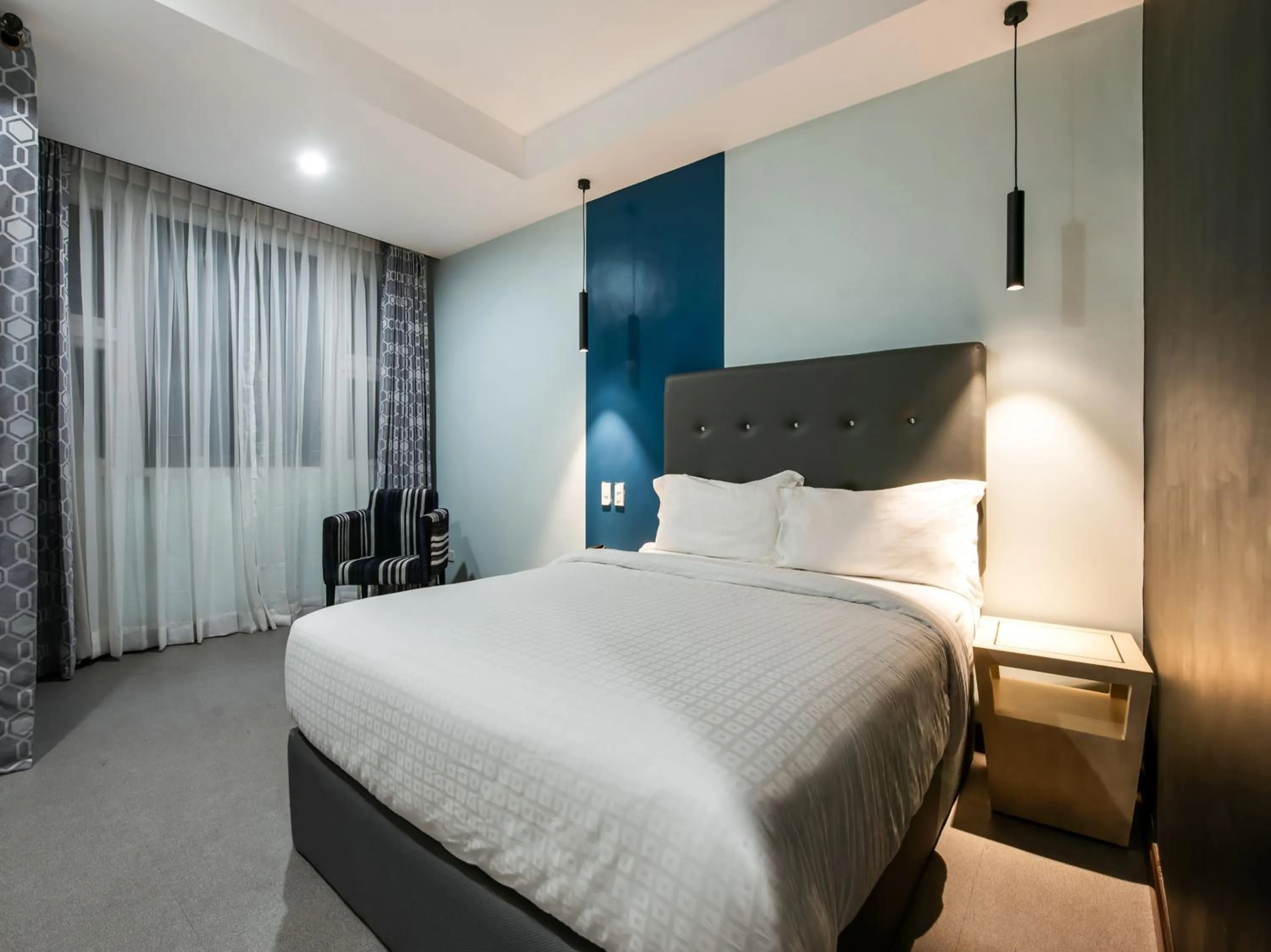 Bed in Bay Area Suites Manila