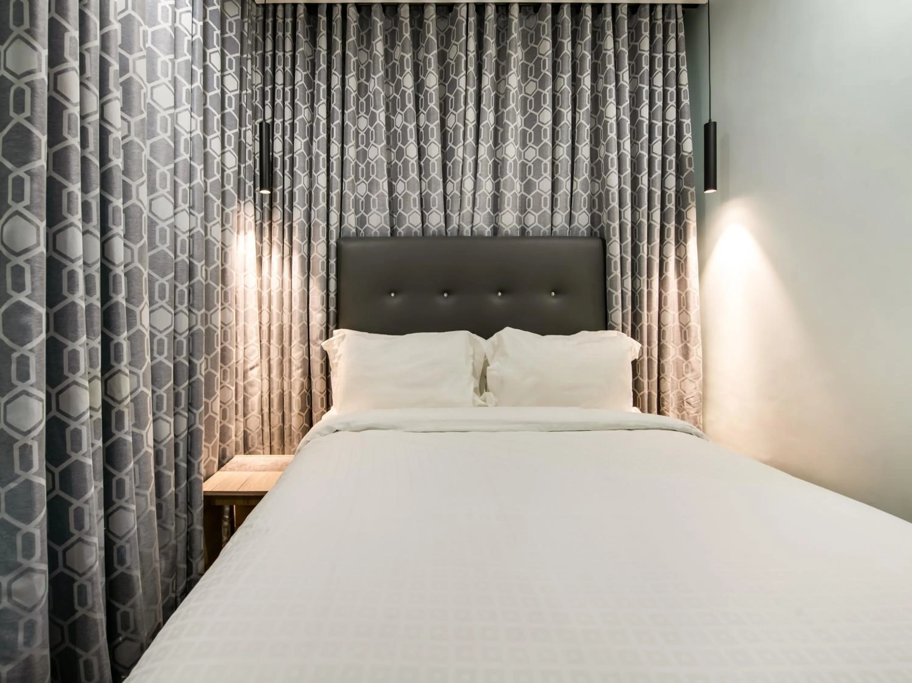 Bed in Bay Area Suites Manila