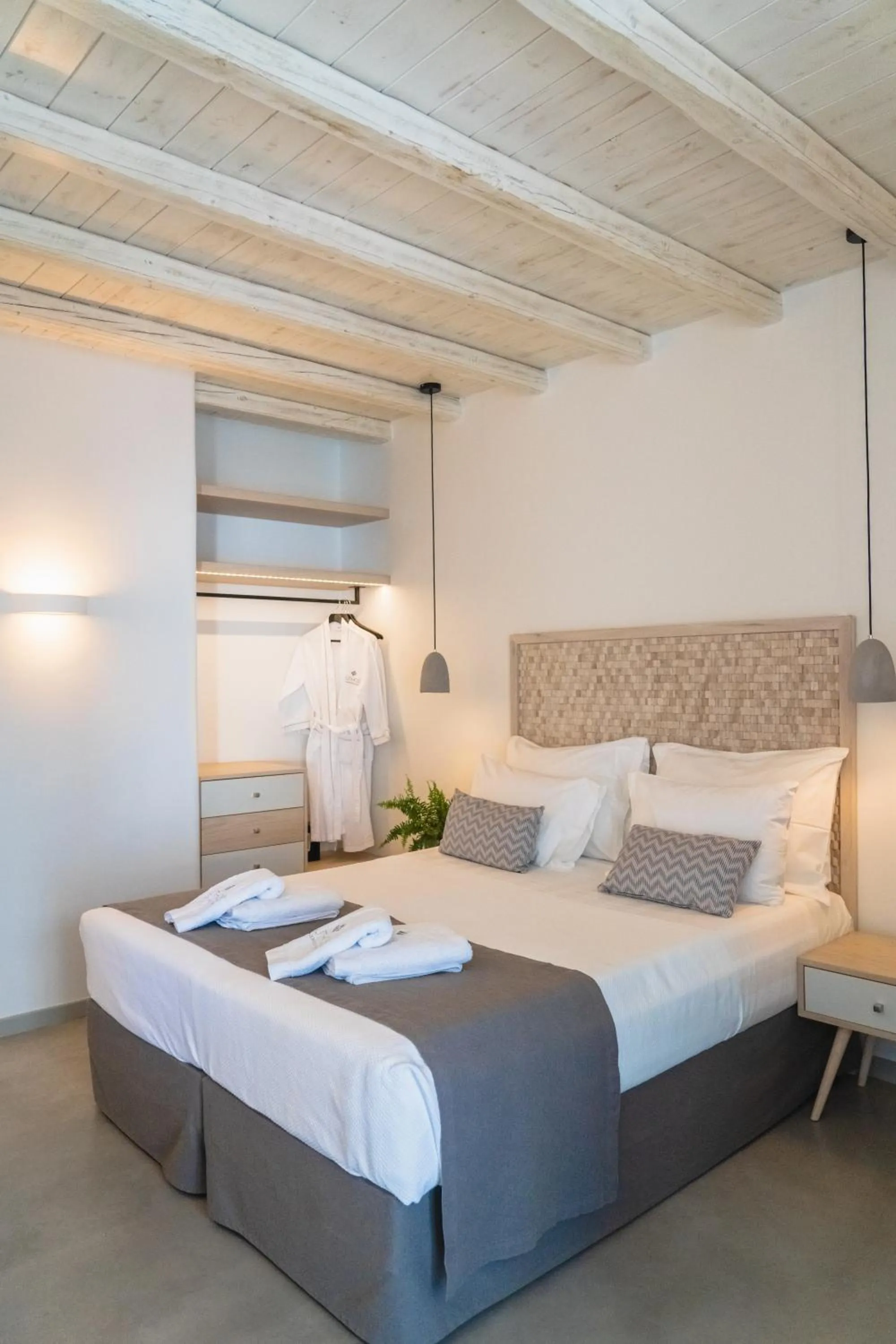 Bed in Lithos Luxury Suites