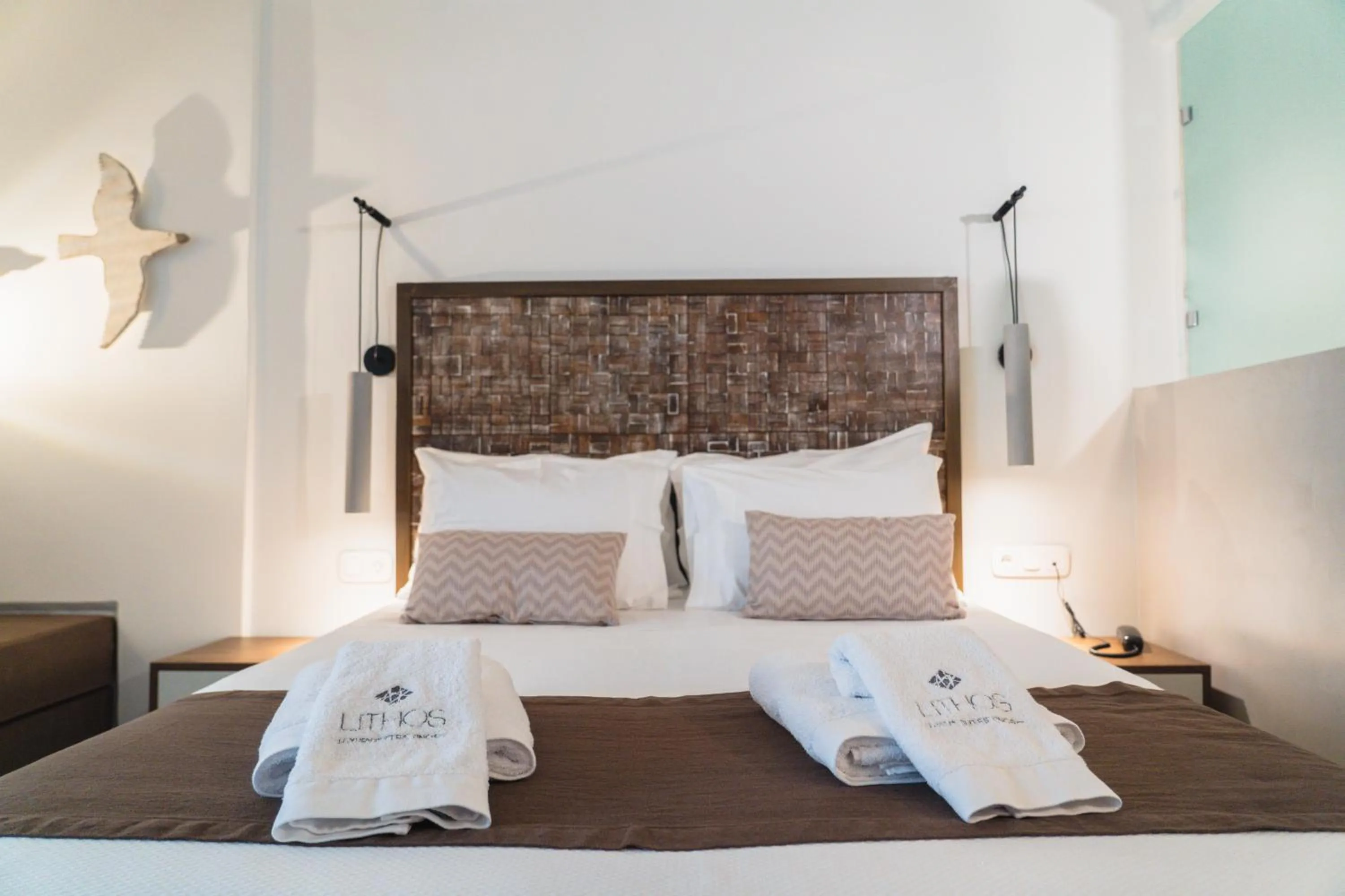 Bed in Lithos Luxury Suites