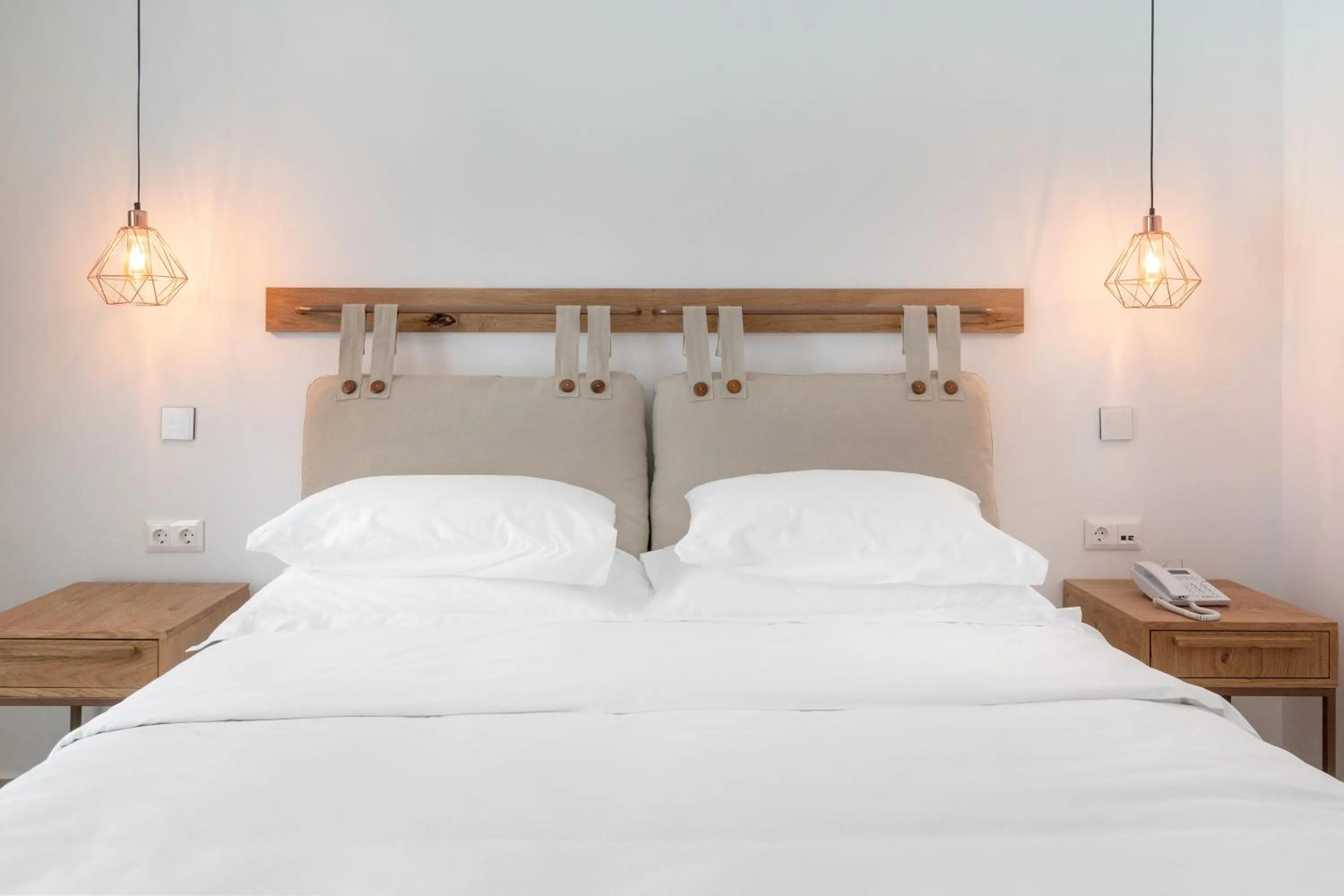 Bed in Omnia Mykonos Boutique Hotel & Suites