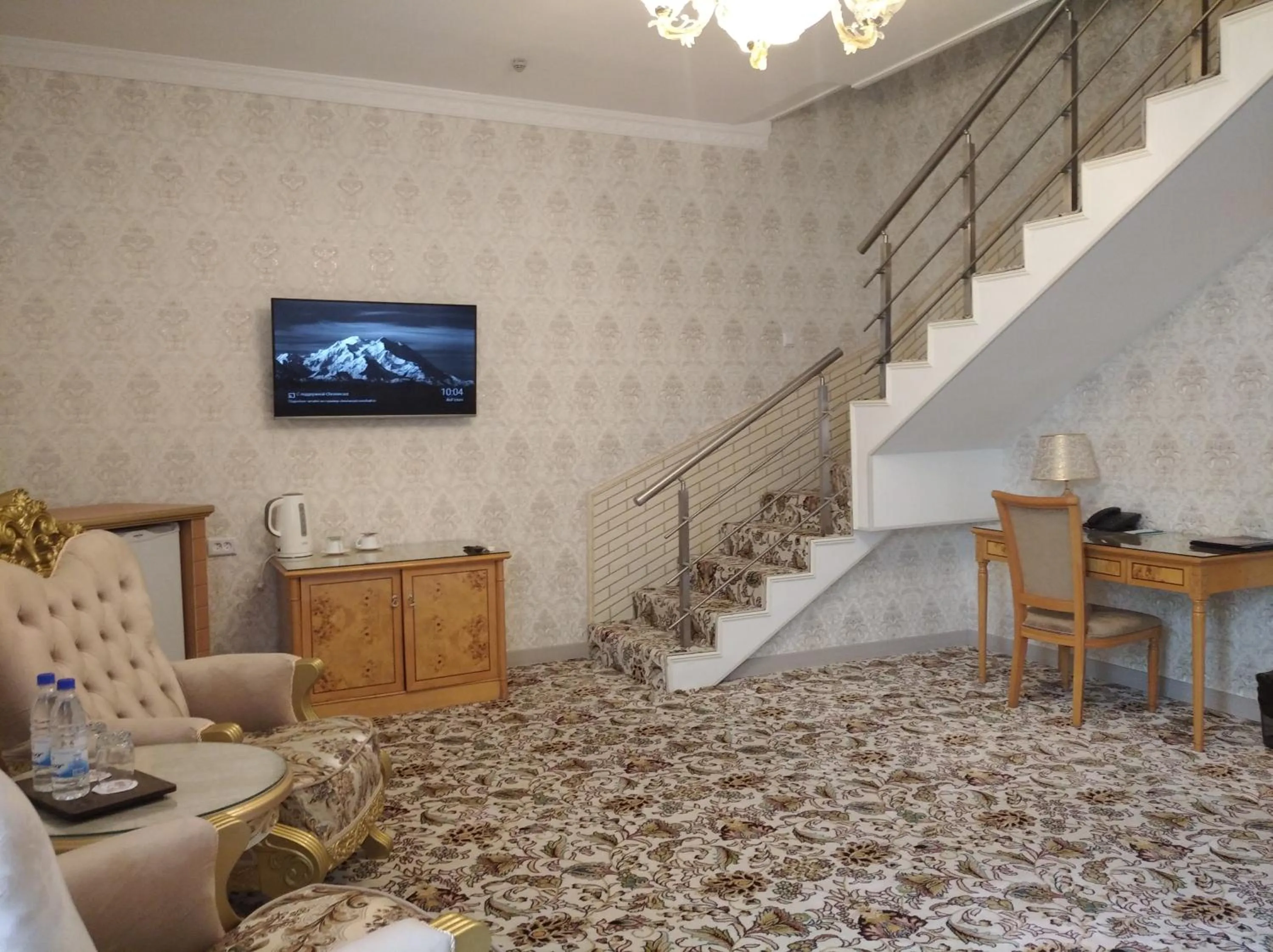 Communal lounge/ TV room in Asia Hotel Fergana