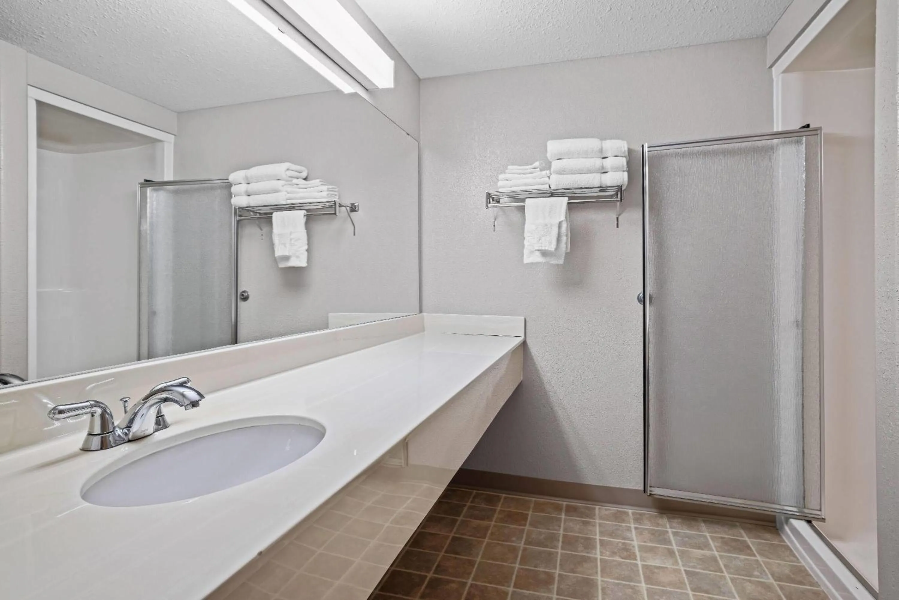 Bathroom in Days Inn & Suites by Wyndham Winkler