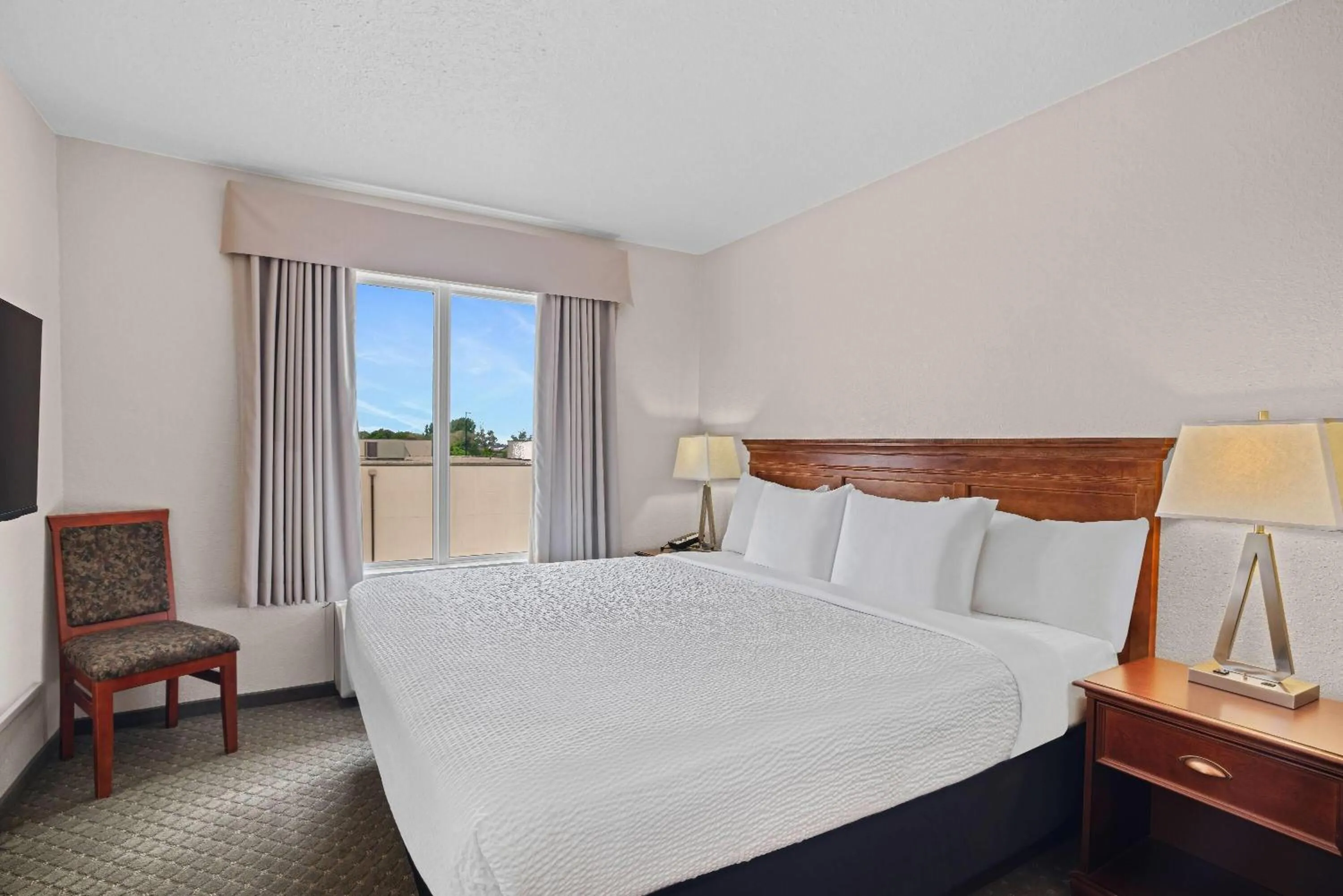 Bed in Days Inn & Suites by Wyndham Winkler