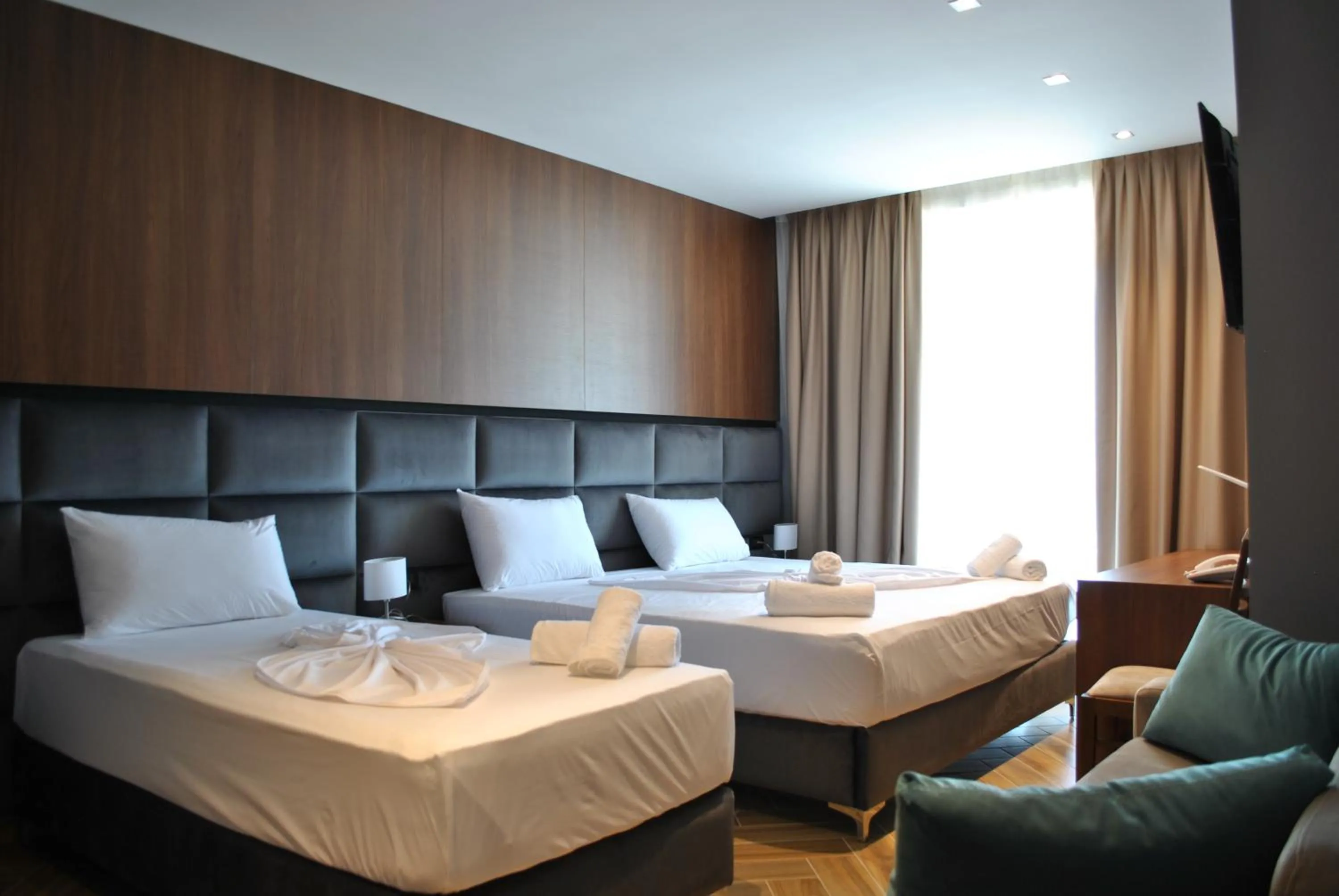 Bed in Twin Towers Hotel City & Beach Resort