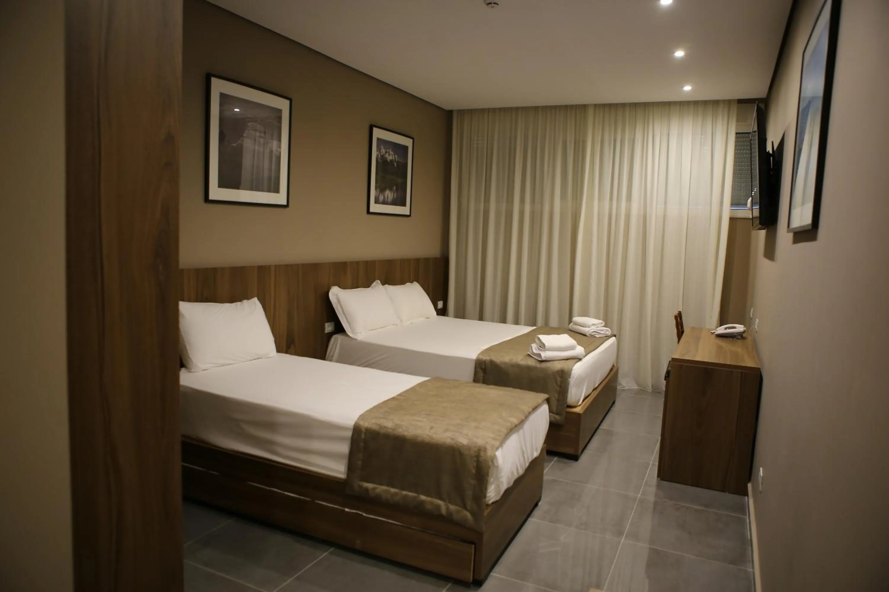Bed in Twin Towers Hotel City & Beach Resort
