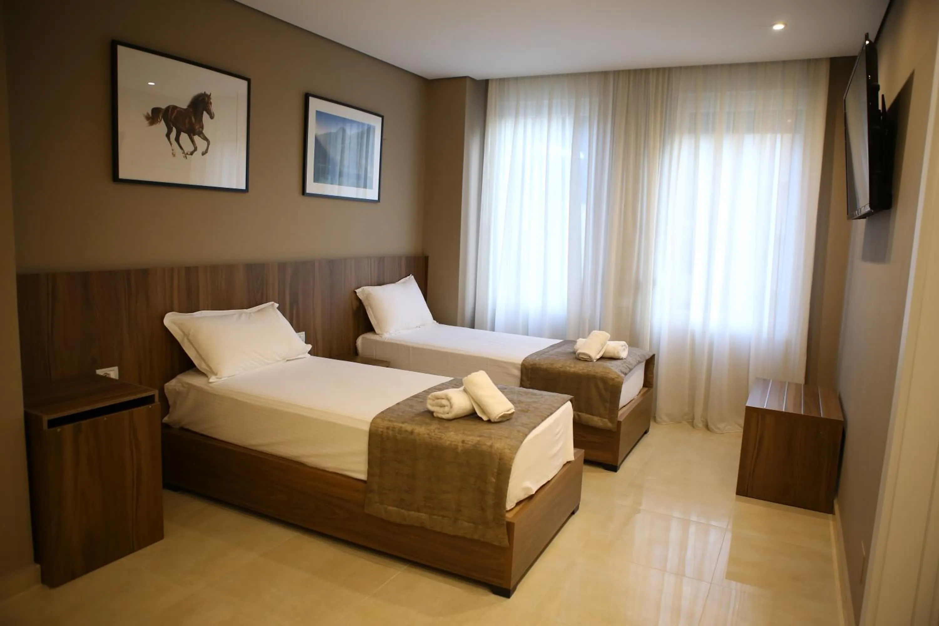 Bed in Twin Towers Hotel City & Beach Resort