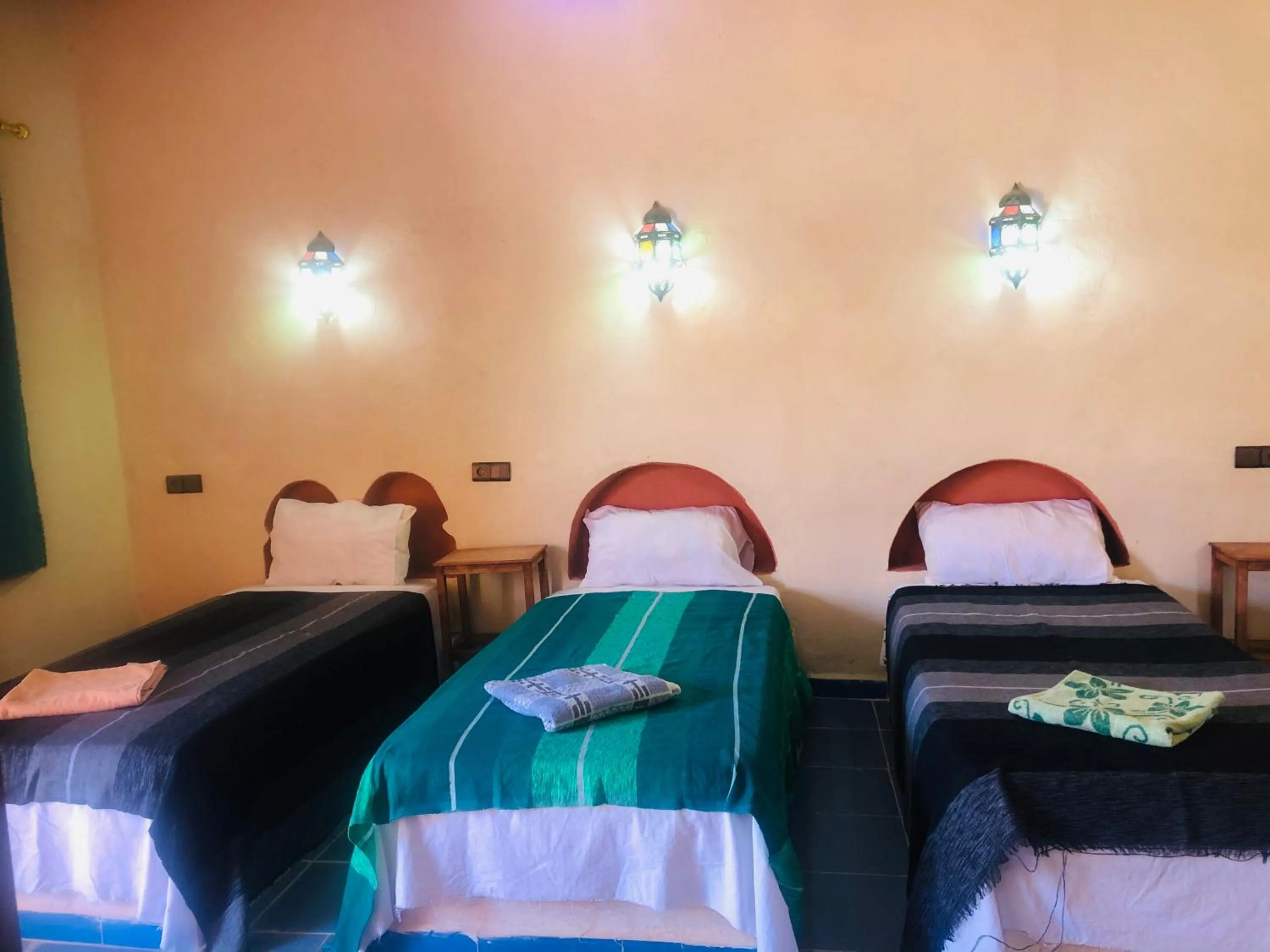 Bed in Riad Hotel Les Flamants