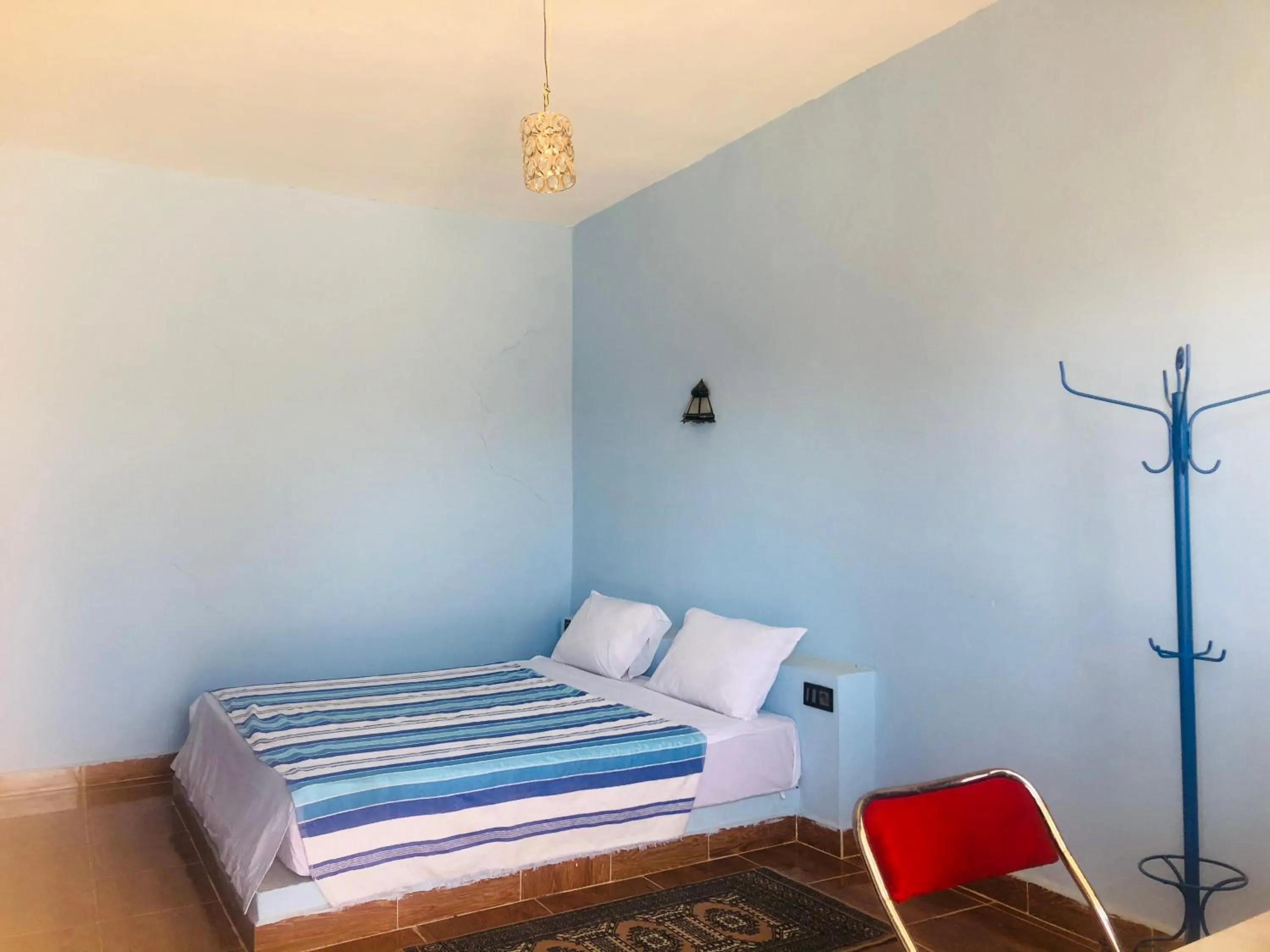 Bed in Riad Hotel Les Flamants