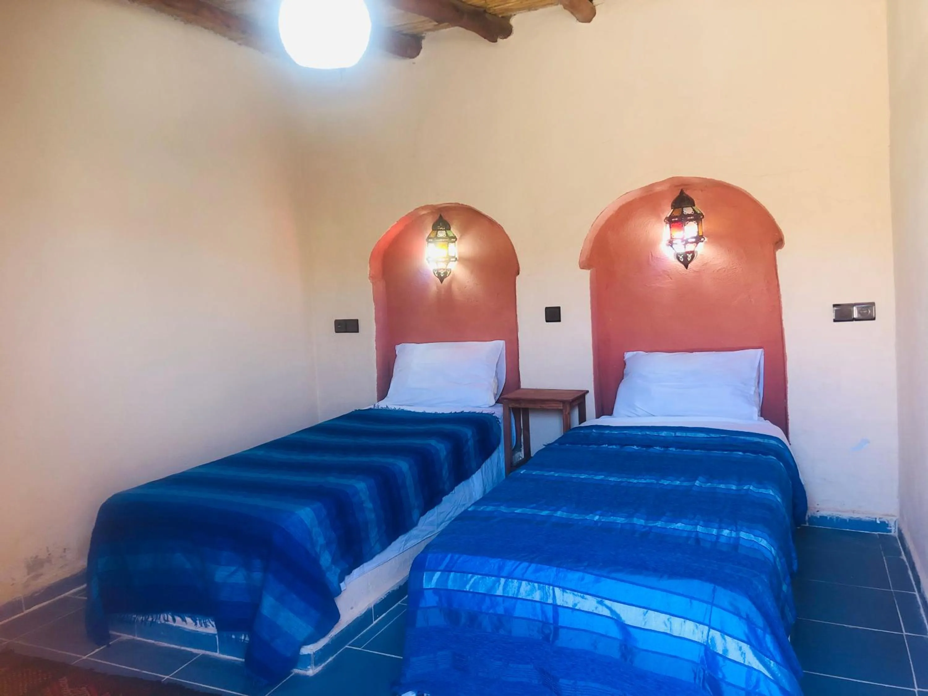 Bed in Riad Hotel Les Flamants