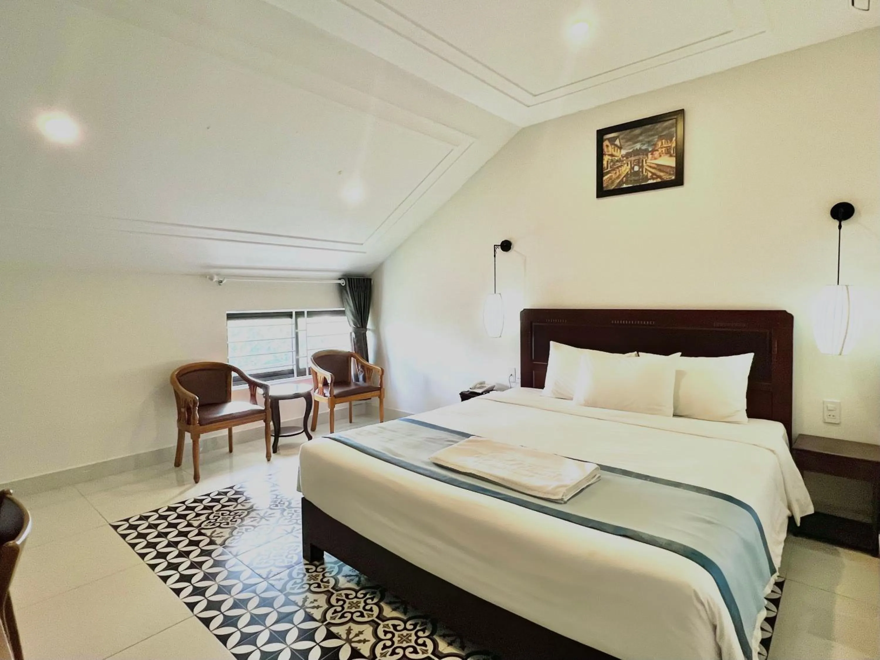 Bed in Grand Holiday Hoian Villa