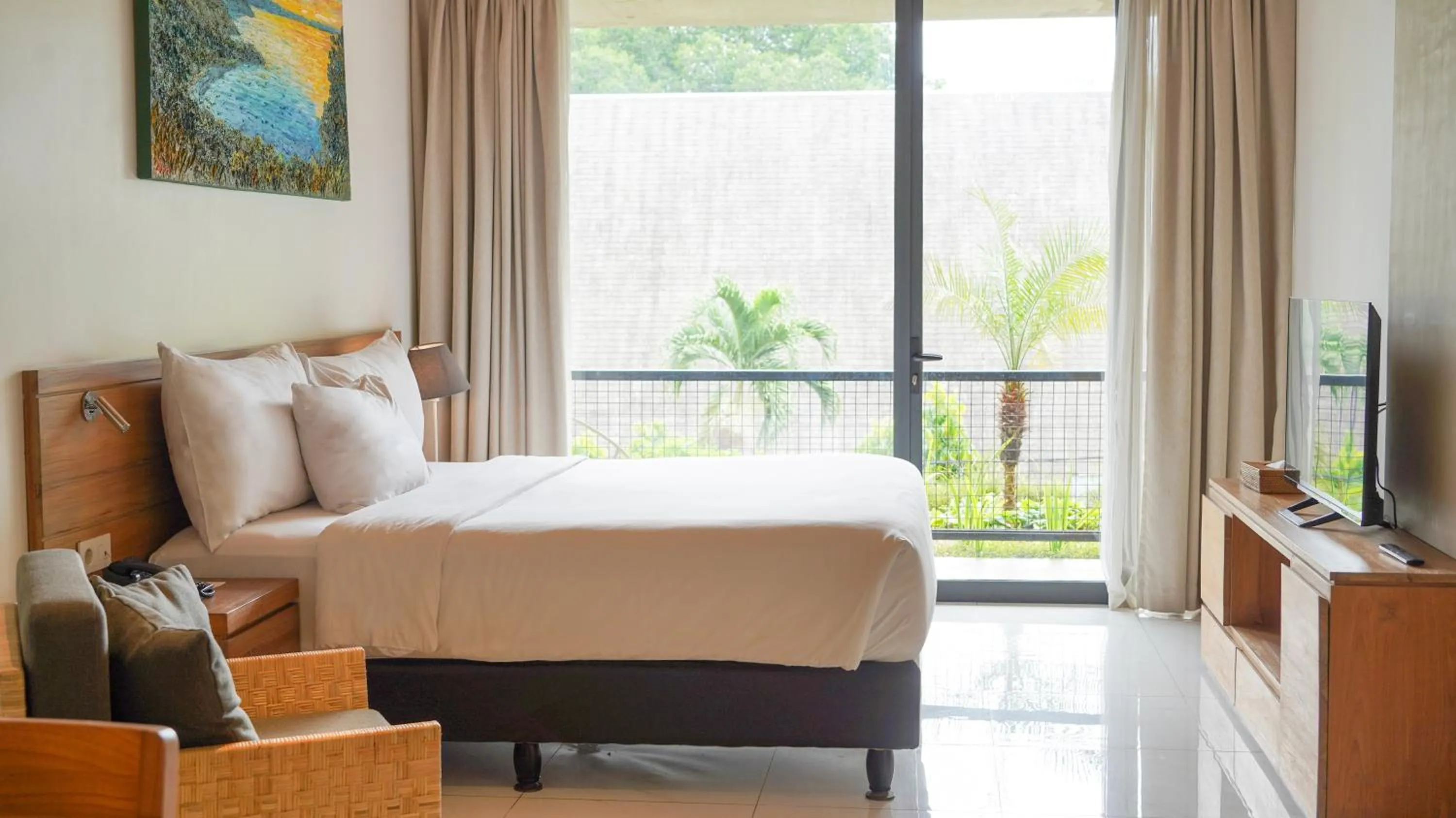 Bed in Nagomi Suites & Hotel