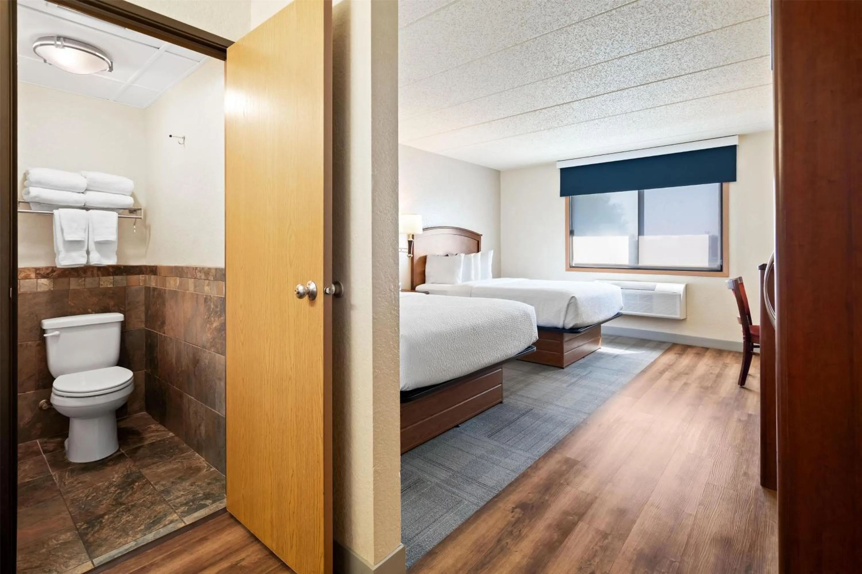 Photo of the whole room, Bed in AmericInn by Wyndham Dickinson