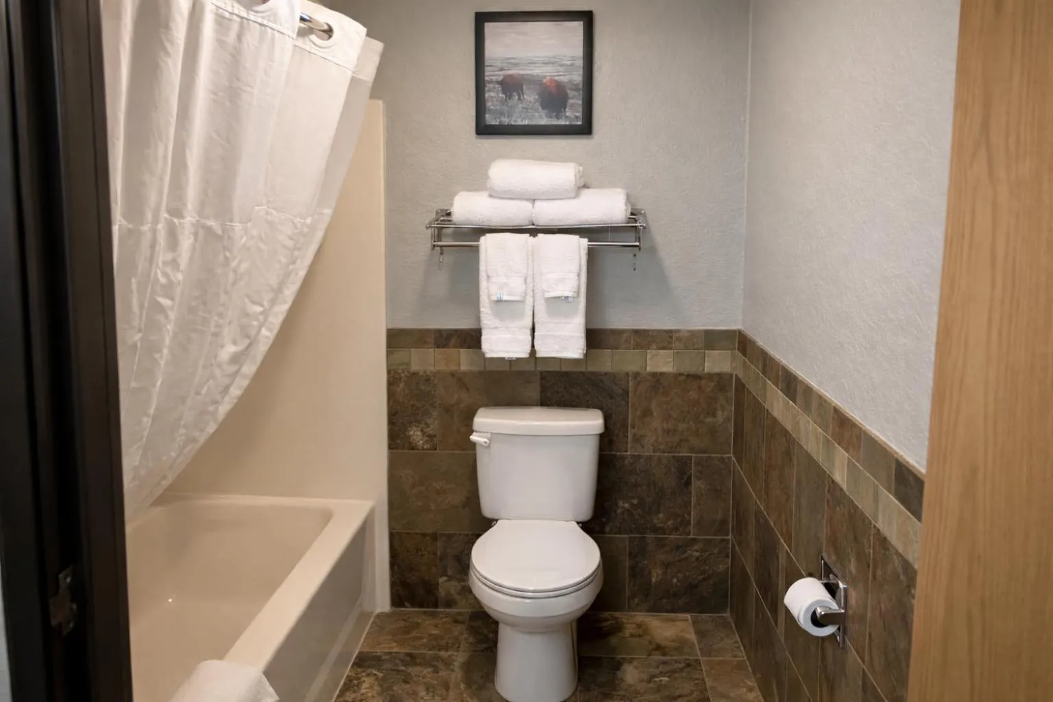 Bathroom in AmericInn by Wyndham Dickinson