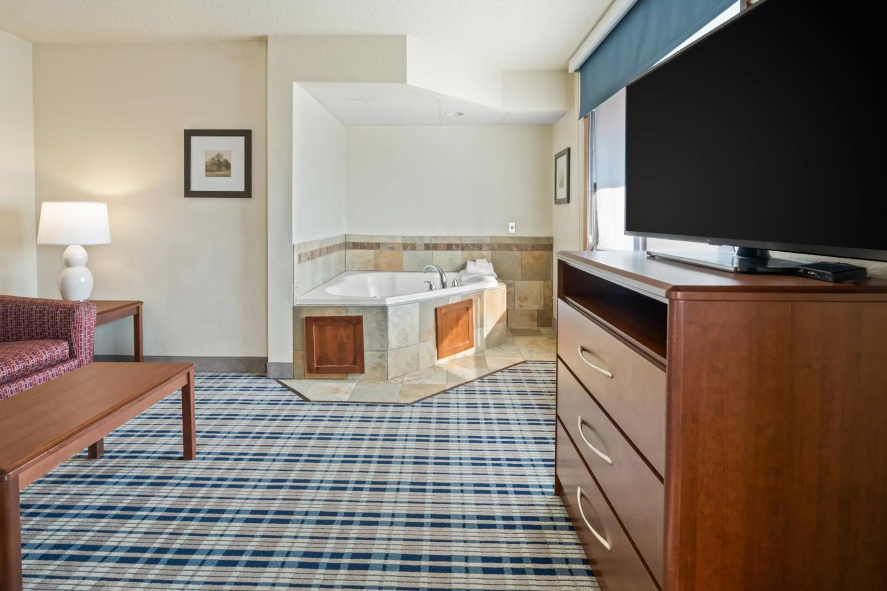 Living room, Bed in AmericInn by Wyndham Dickinson