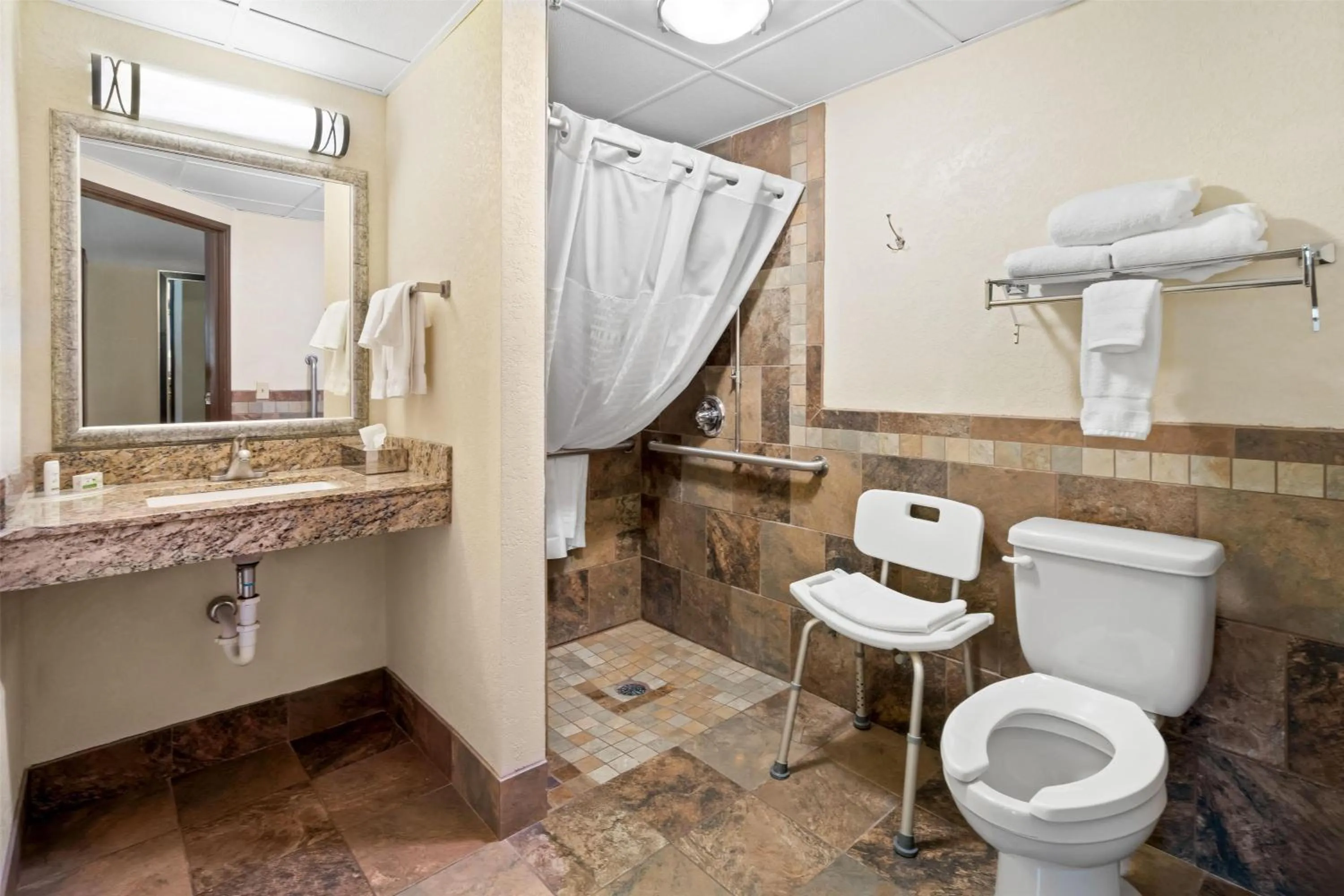 Bathroom in AmericInn by Wyndham Dickinson