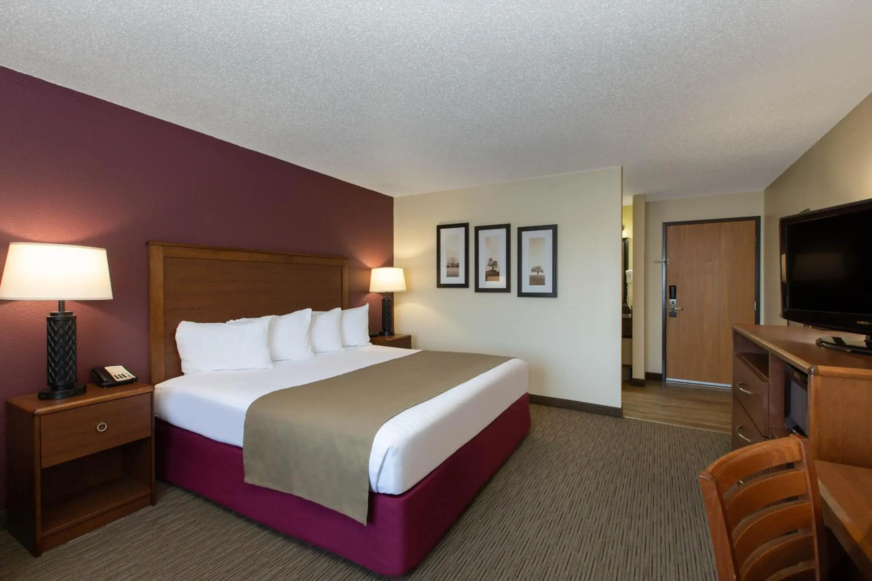 Bed in AmericInn by Wyndham Merrill Bed in AmericInn by Wyndham Merrill