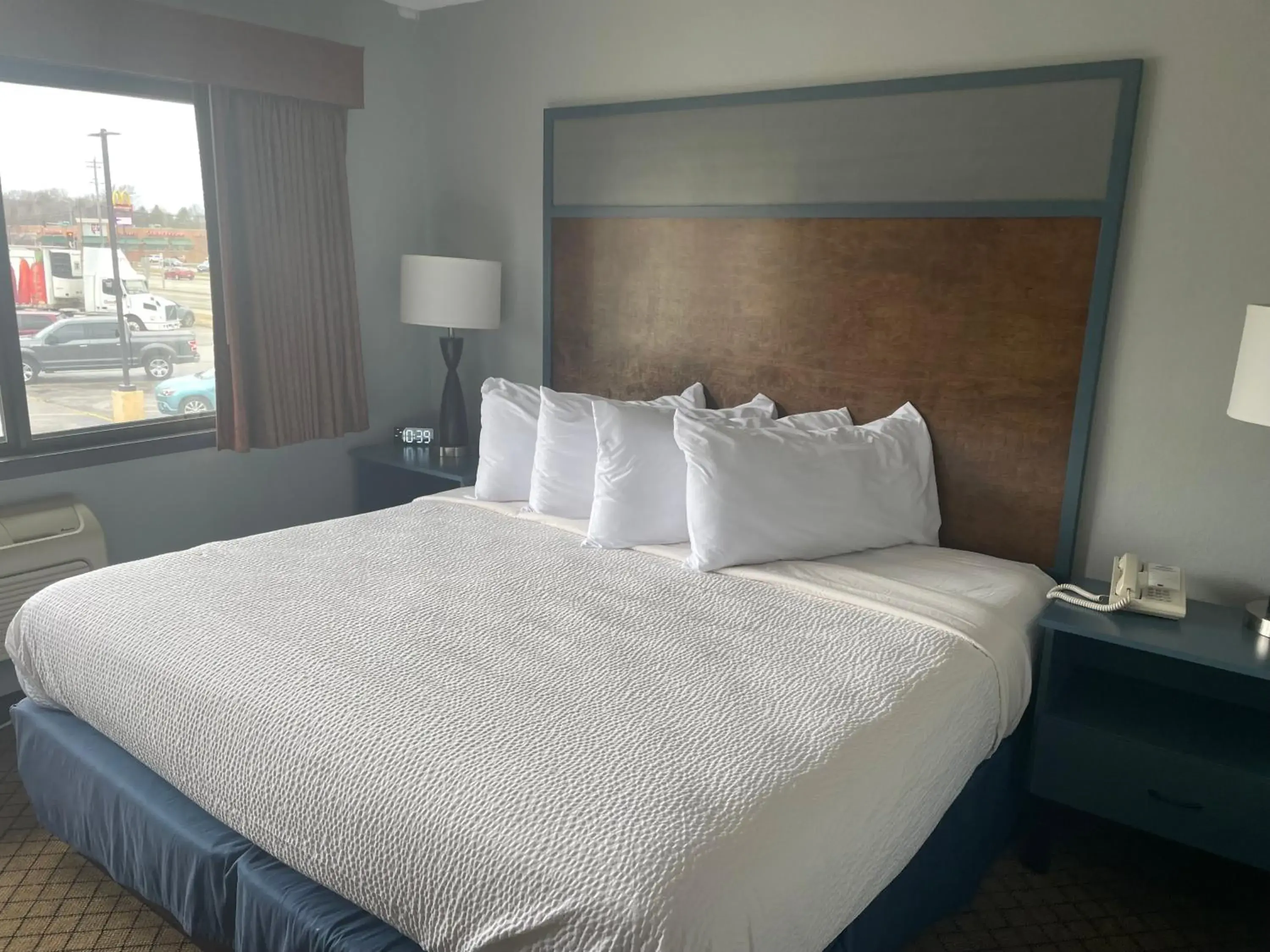 Bedroom, Bed in AmericInn by Wyndham Hartford WI Bedroom, Bed in AmericInn by Wyndham Hartford WI