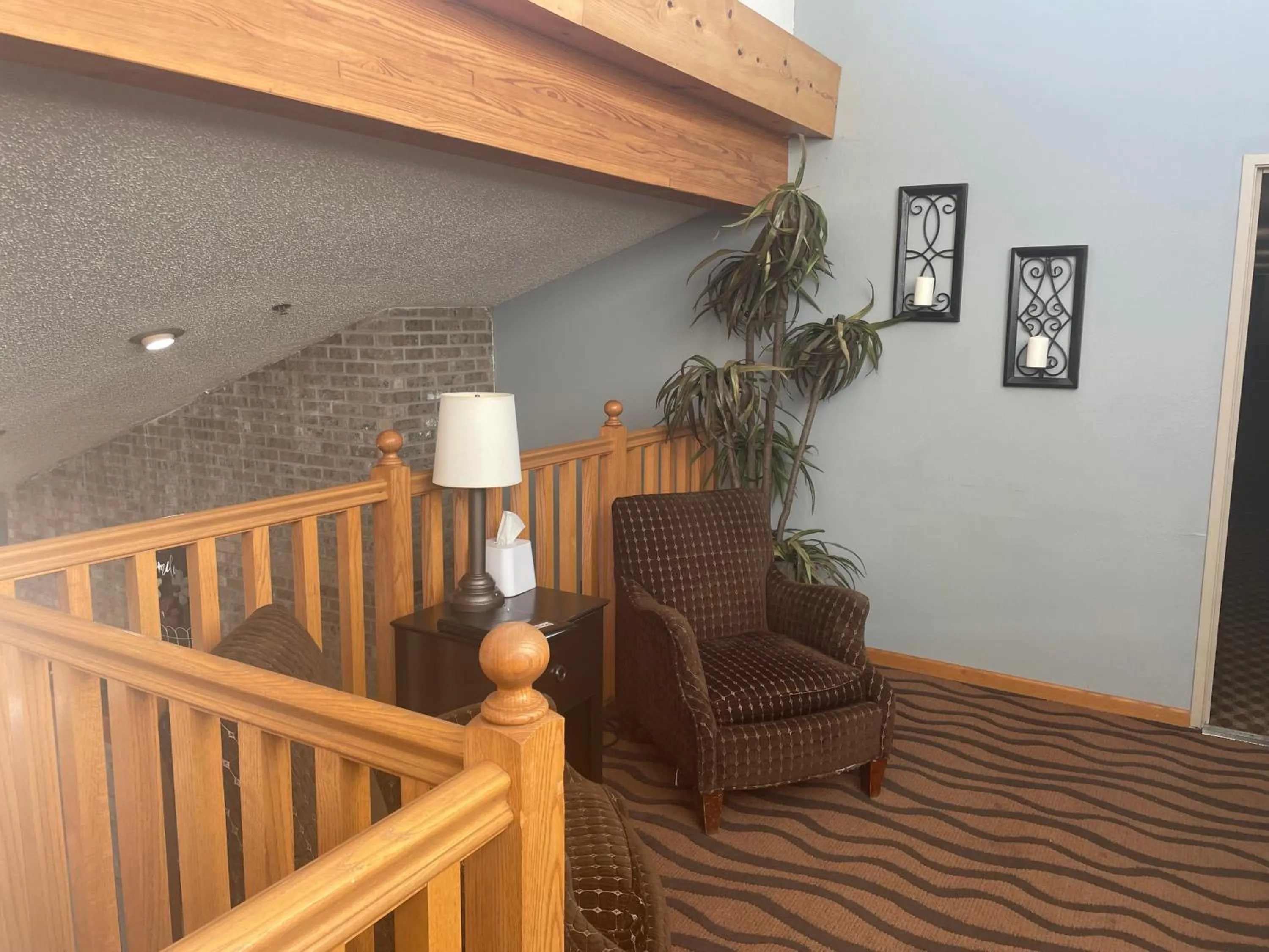 Seating area in AmericInn by Wyndham Hartford WI