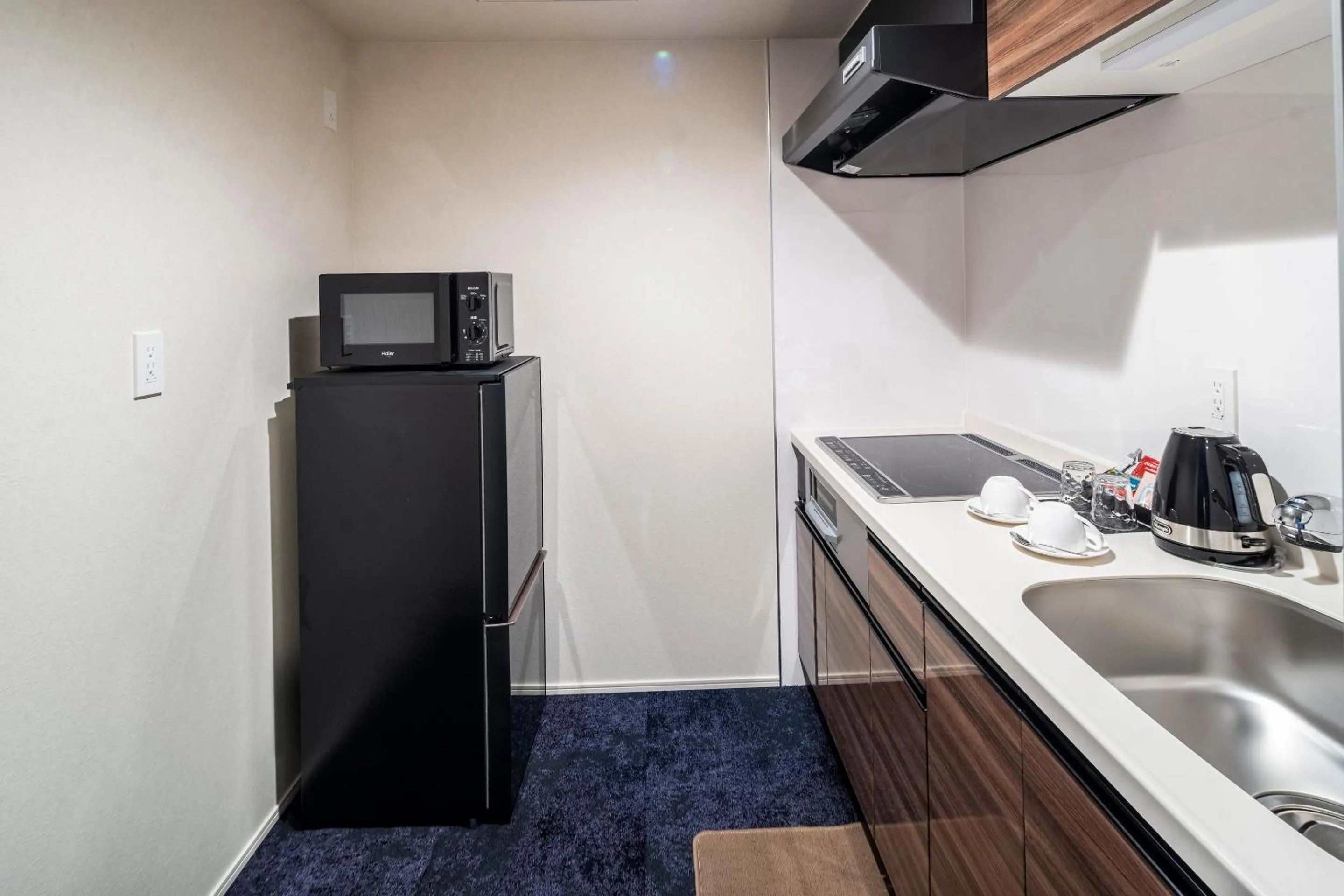 Kitchen or kitchenette in RESI STAY Mayu Grace Hotel