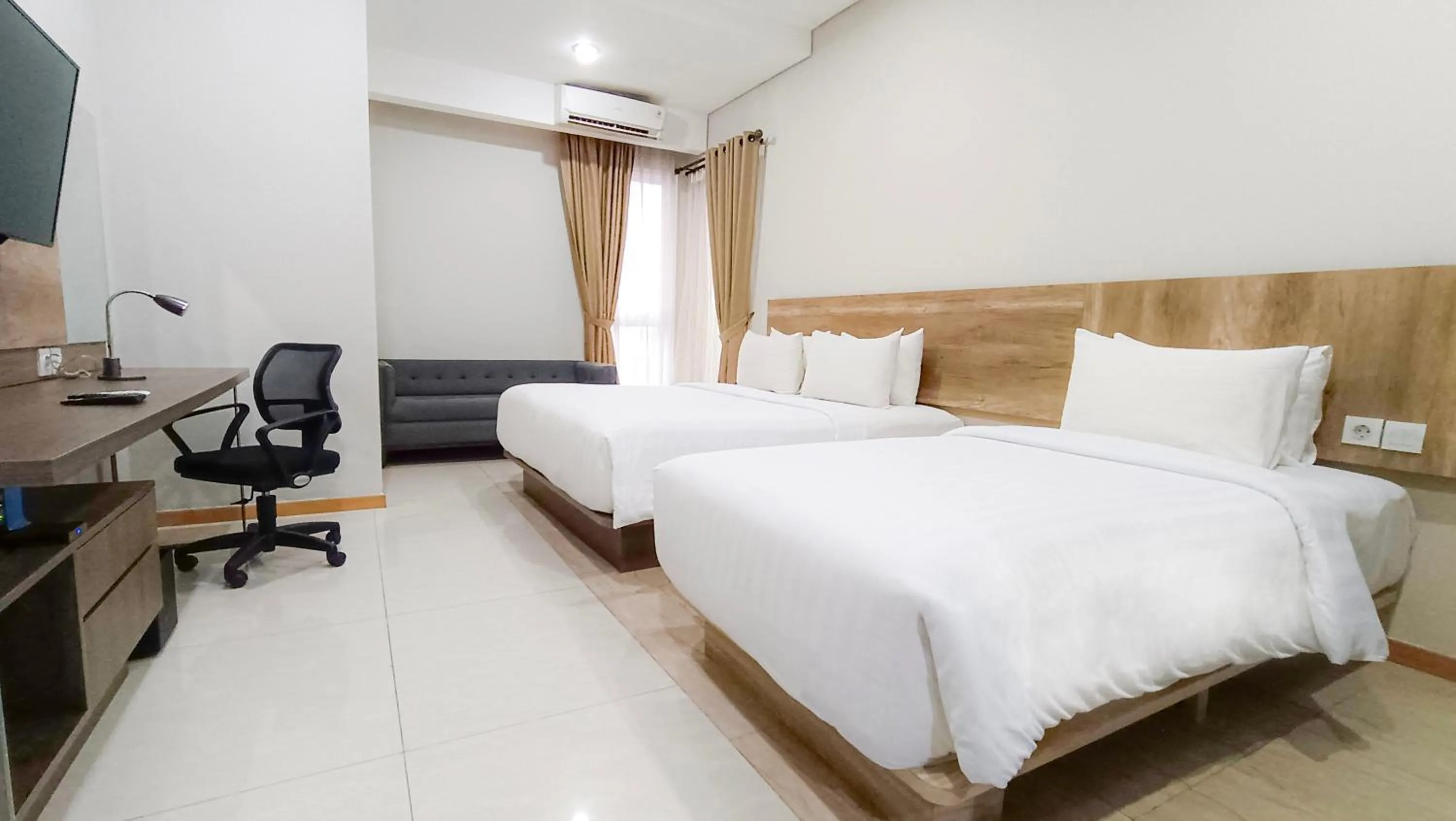Bed in Grande Valore Hotel Cikarang