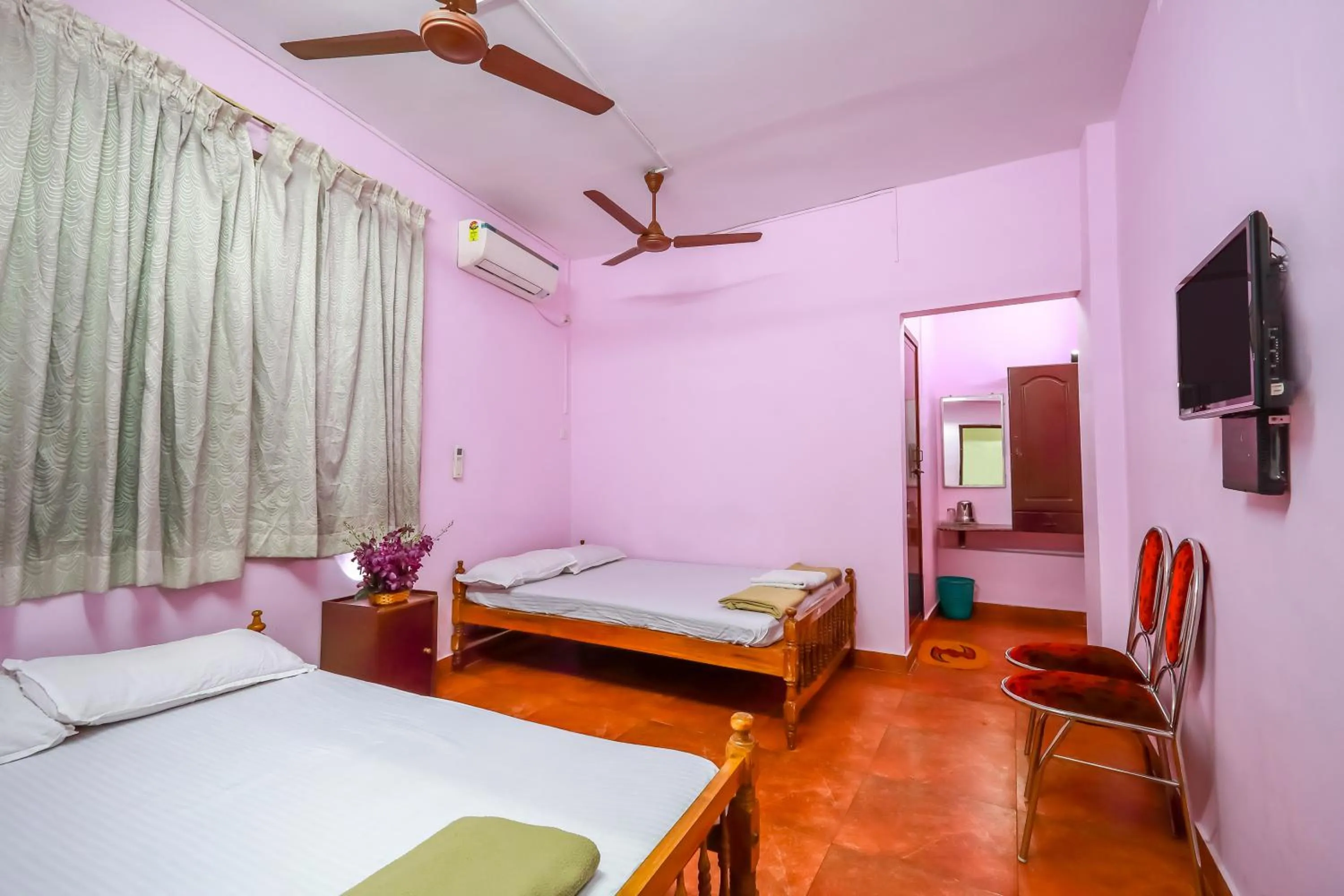 Bed in Sri Udupi Hotel