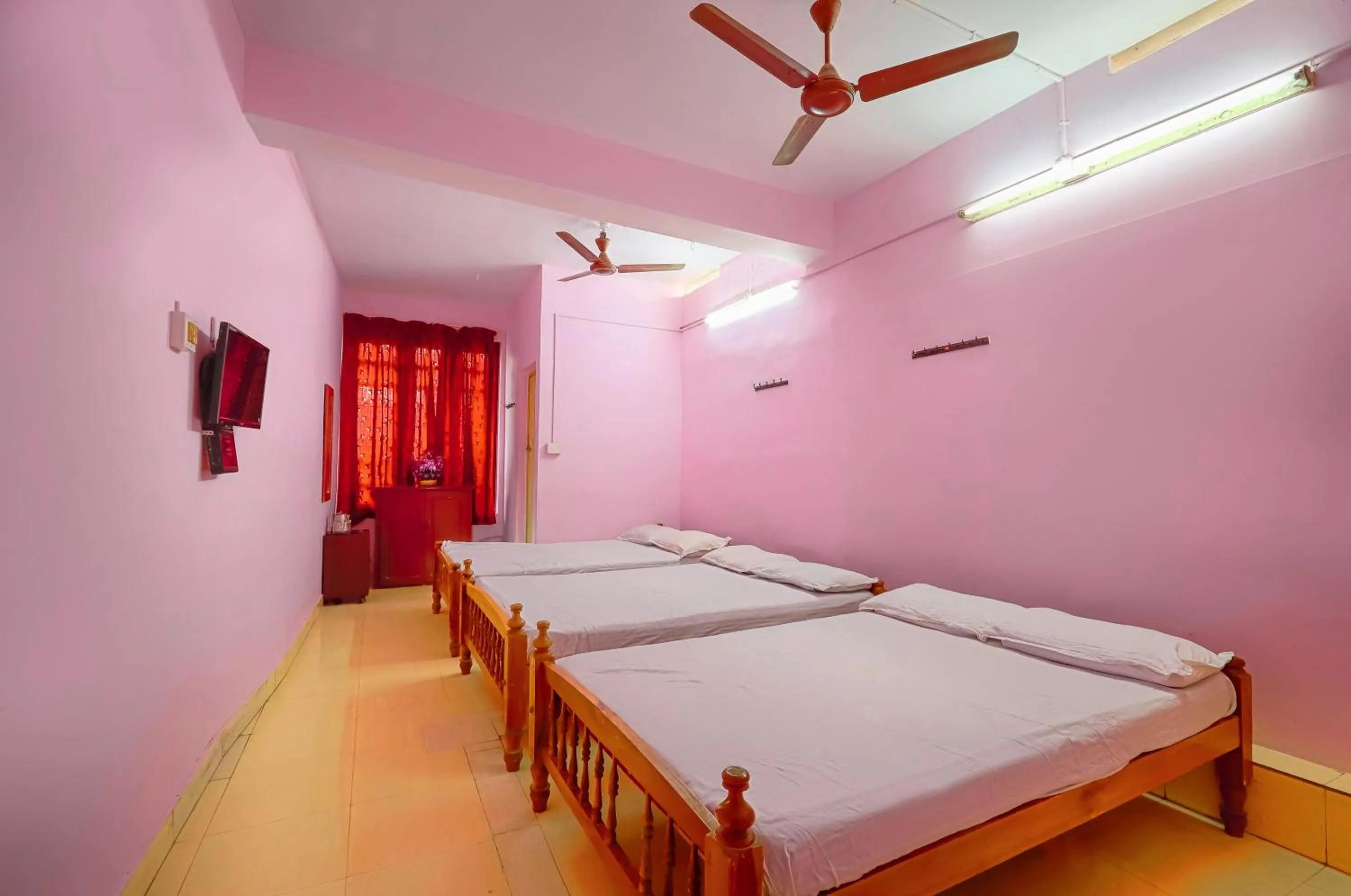 Bed in Sri Udupi Hotel