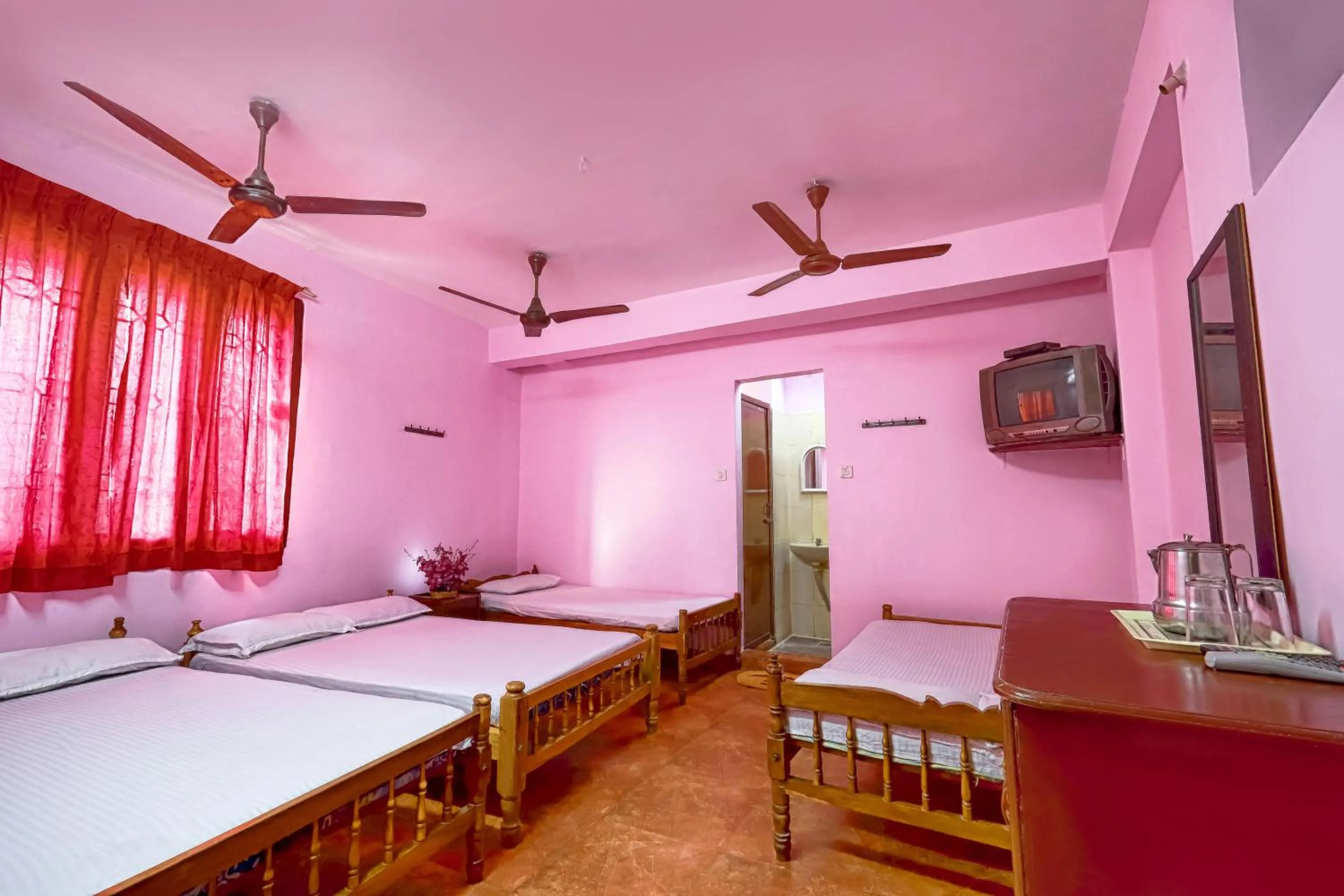 Bed in Sri Udupi Hotel