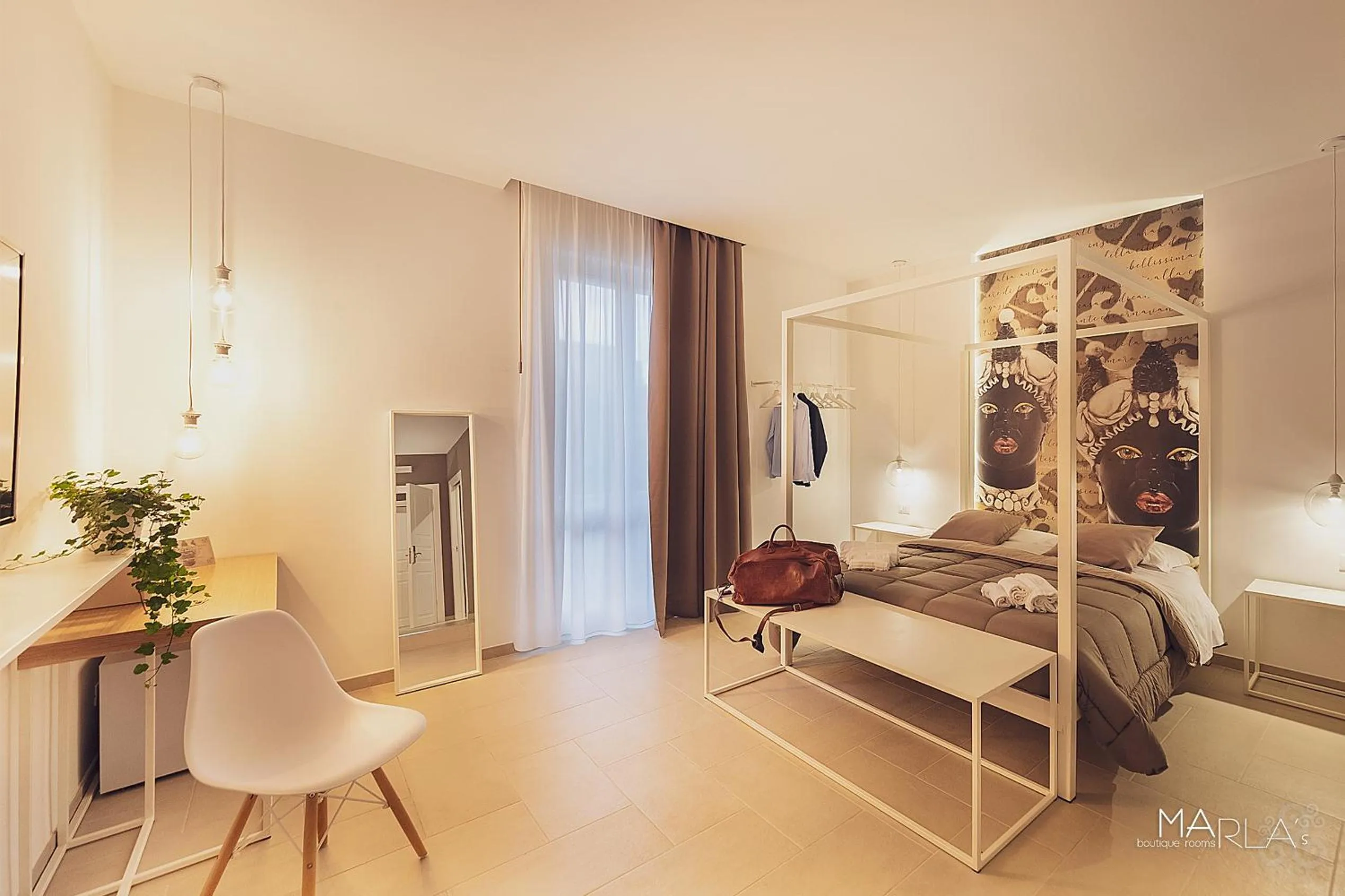 Photo of the whole room, Bed in Marla's boutique rooms