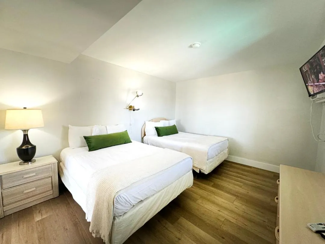 Bed in Coliseum Ocean Resort