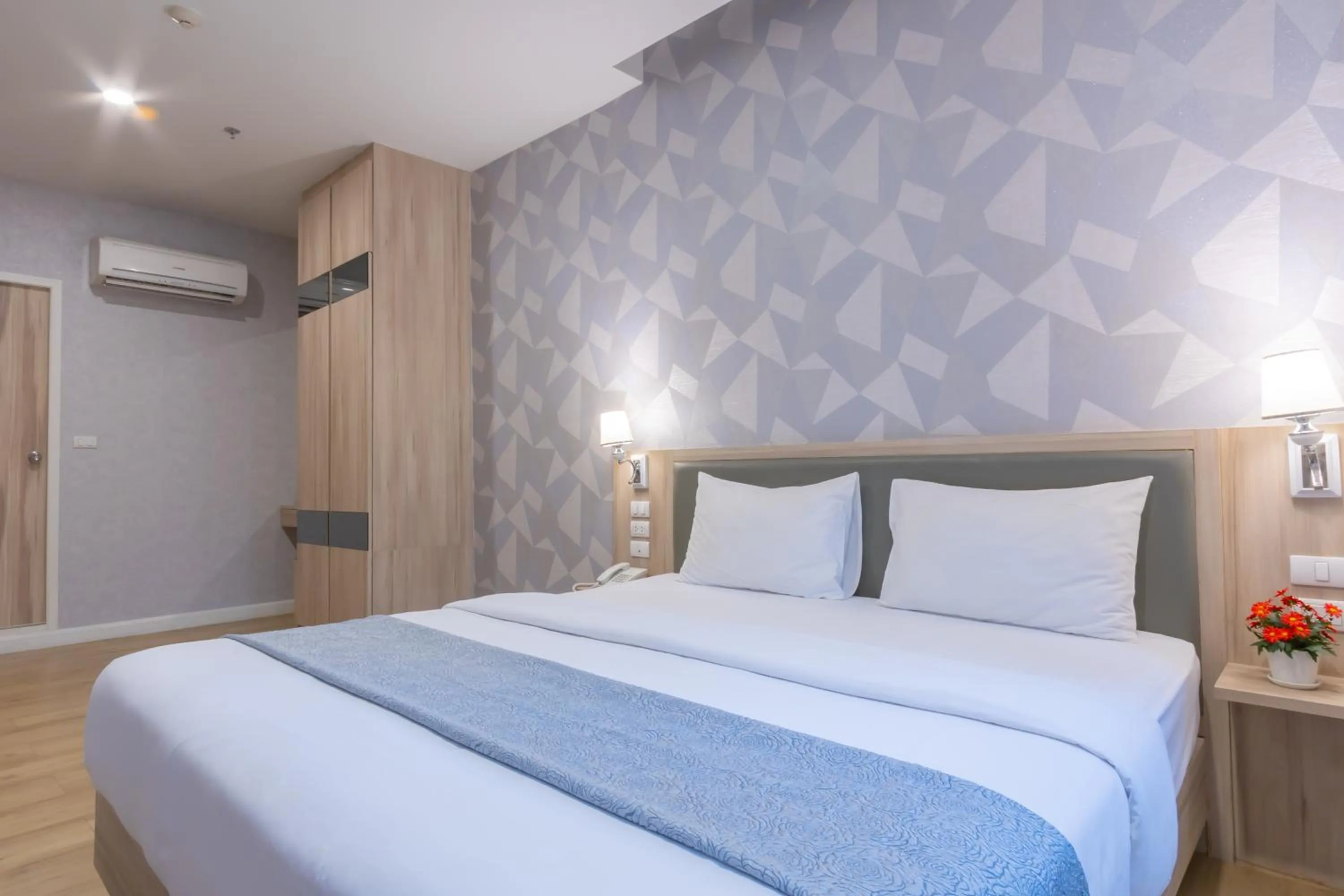 Bed in Leela Orchid Hotel