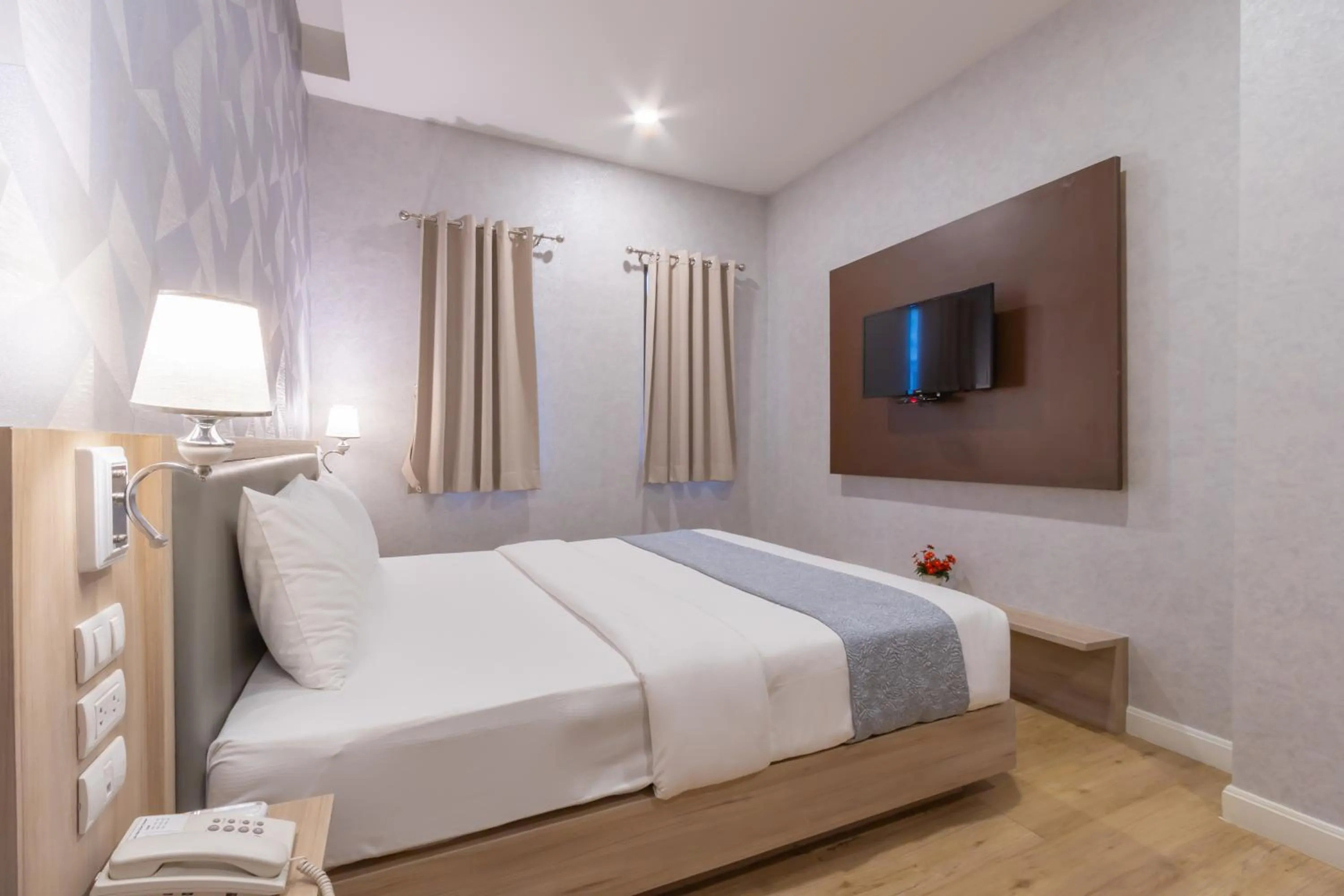 Bed in Leela Orchid Hotel