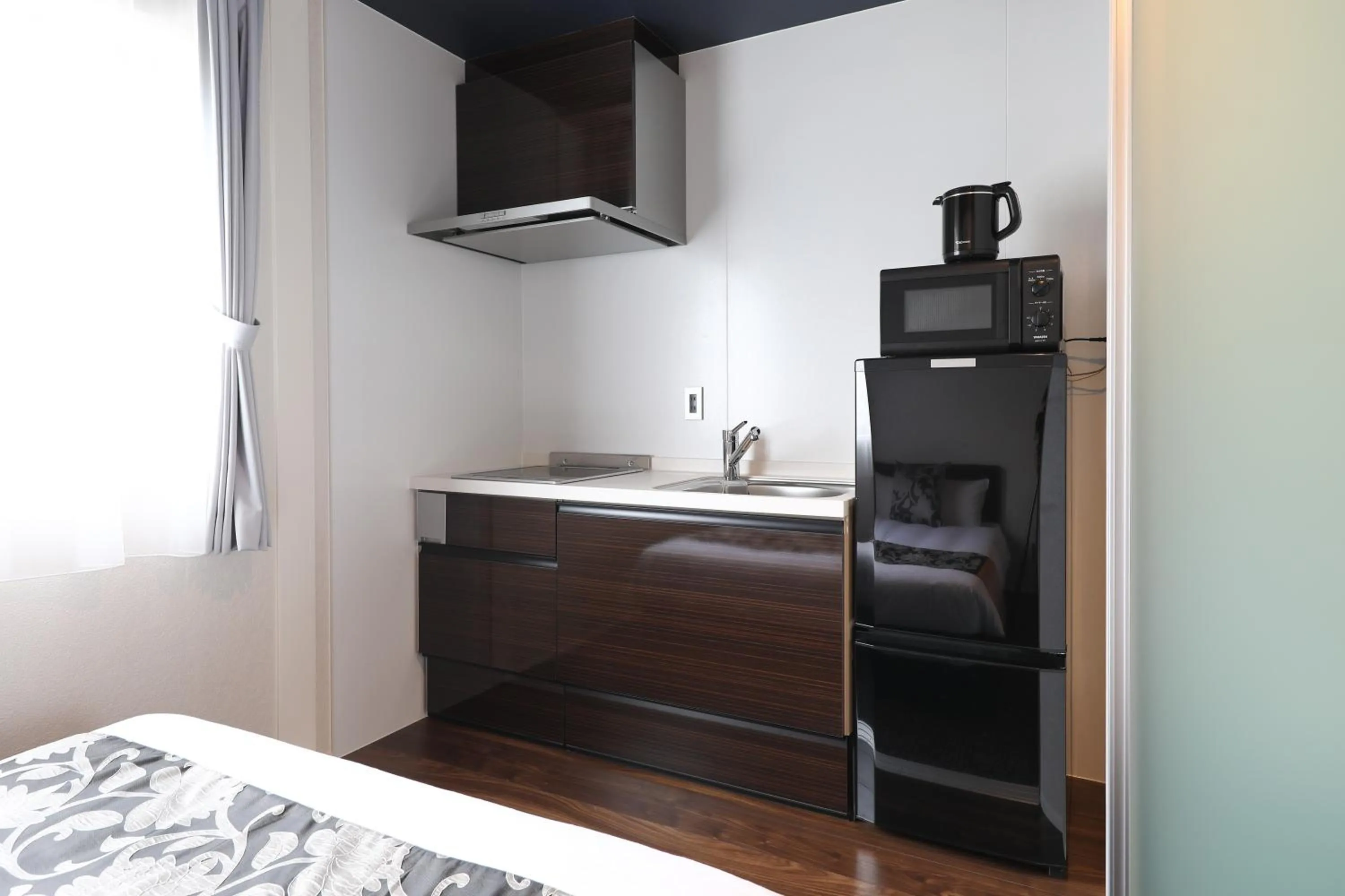 Kitchen or kitchenette, Bed in GRAND BASE Hakata City