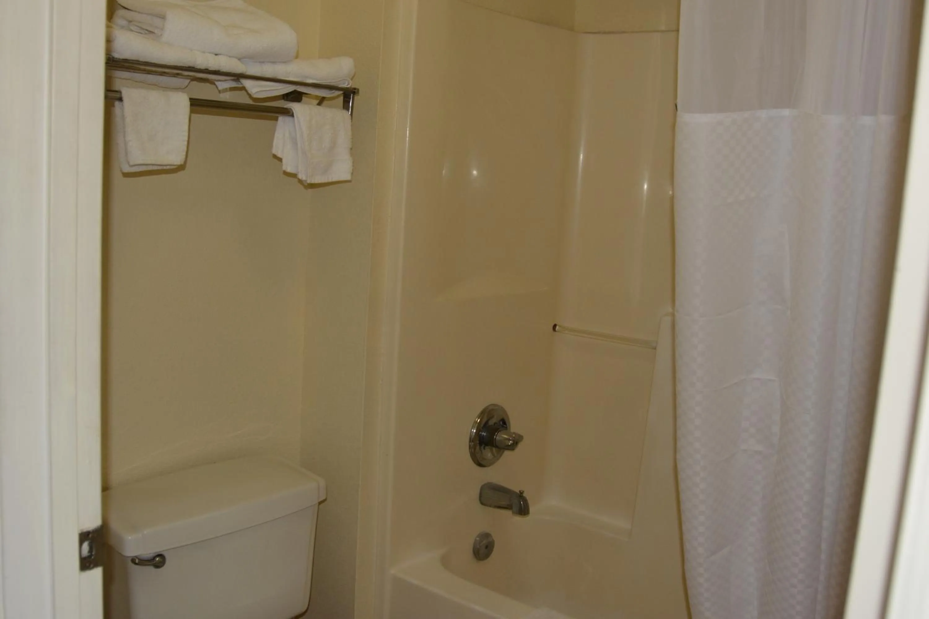 Toilet in Travelodge by Wyndham Montgomery East