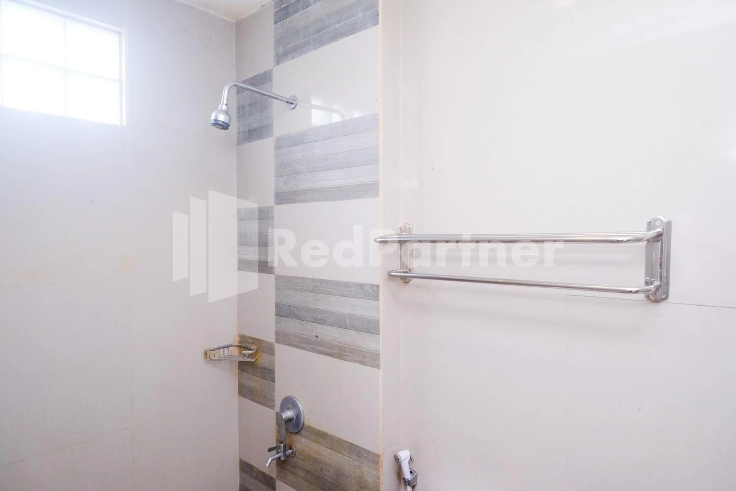 Bathroom in Garuda Guesthouse Yogyakarta RedPartner