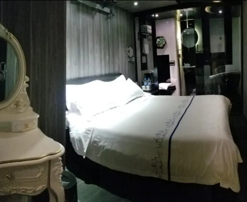 Bed in Star City Hotel
