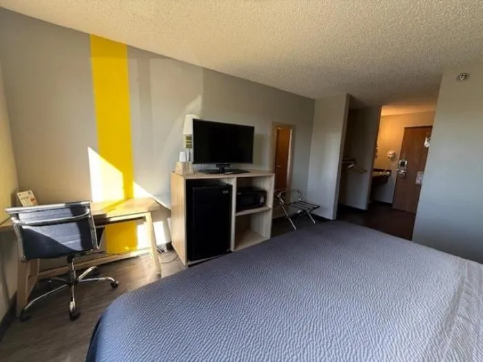 Bed in Super 8 by Wyndham Smithville Kansas City