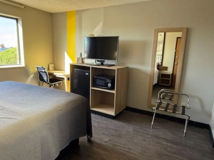 Bed in Super 8 by Wyndham Smithville Kansas City