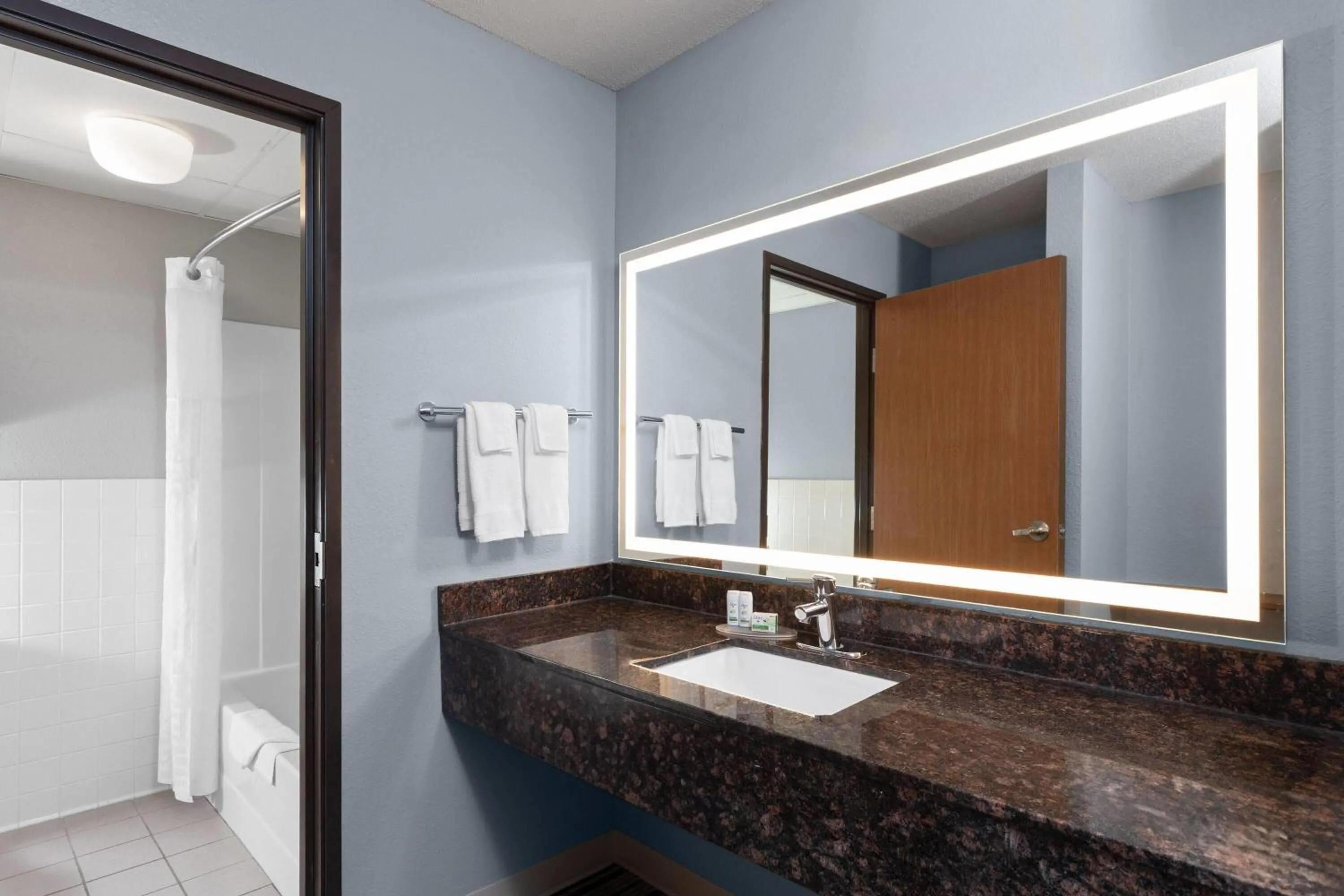 Bathroom in AmericInn by Wyndham West Salem