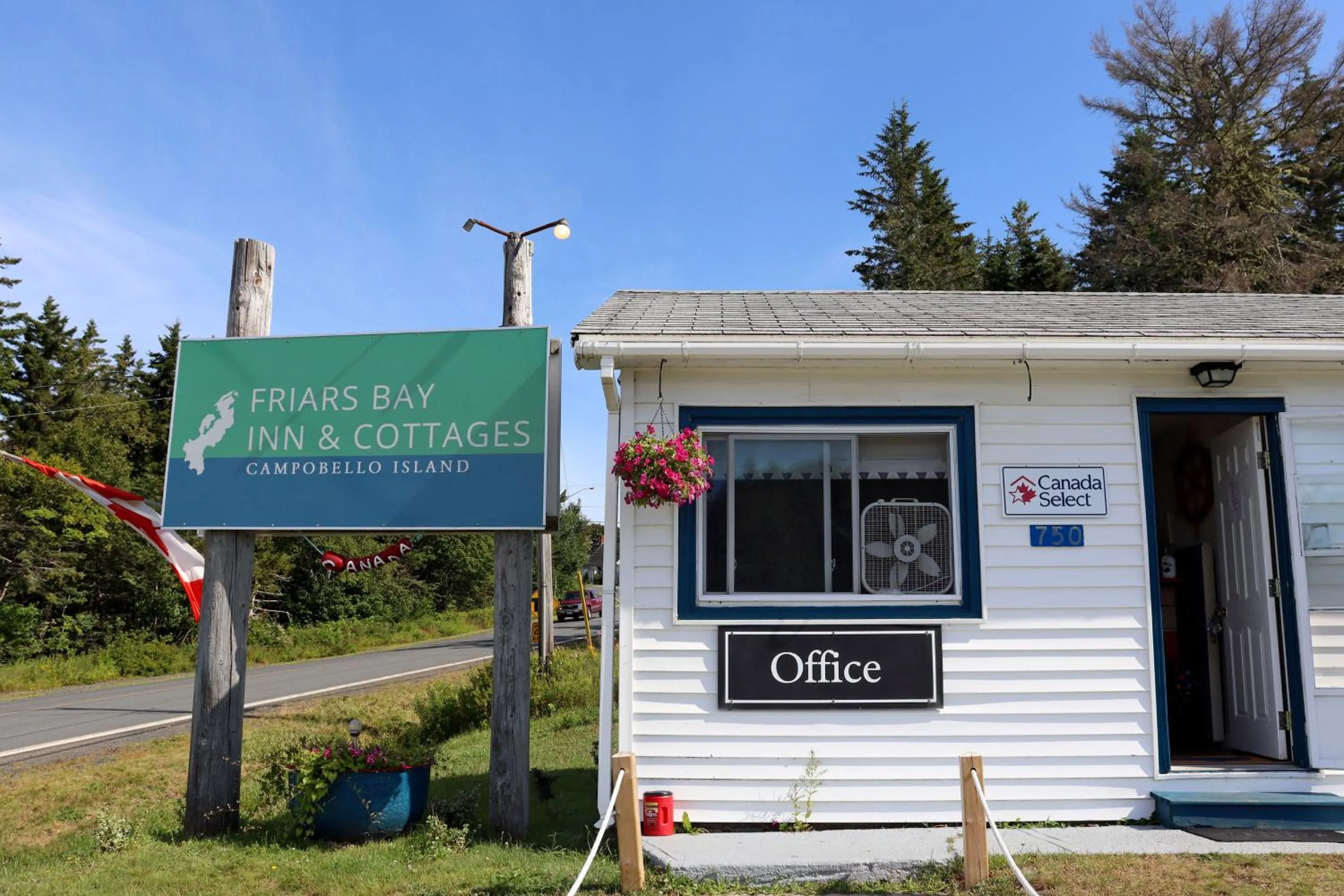 Property logo or sign in Friars Bay Inn & Cottages