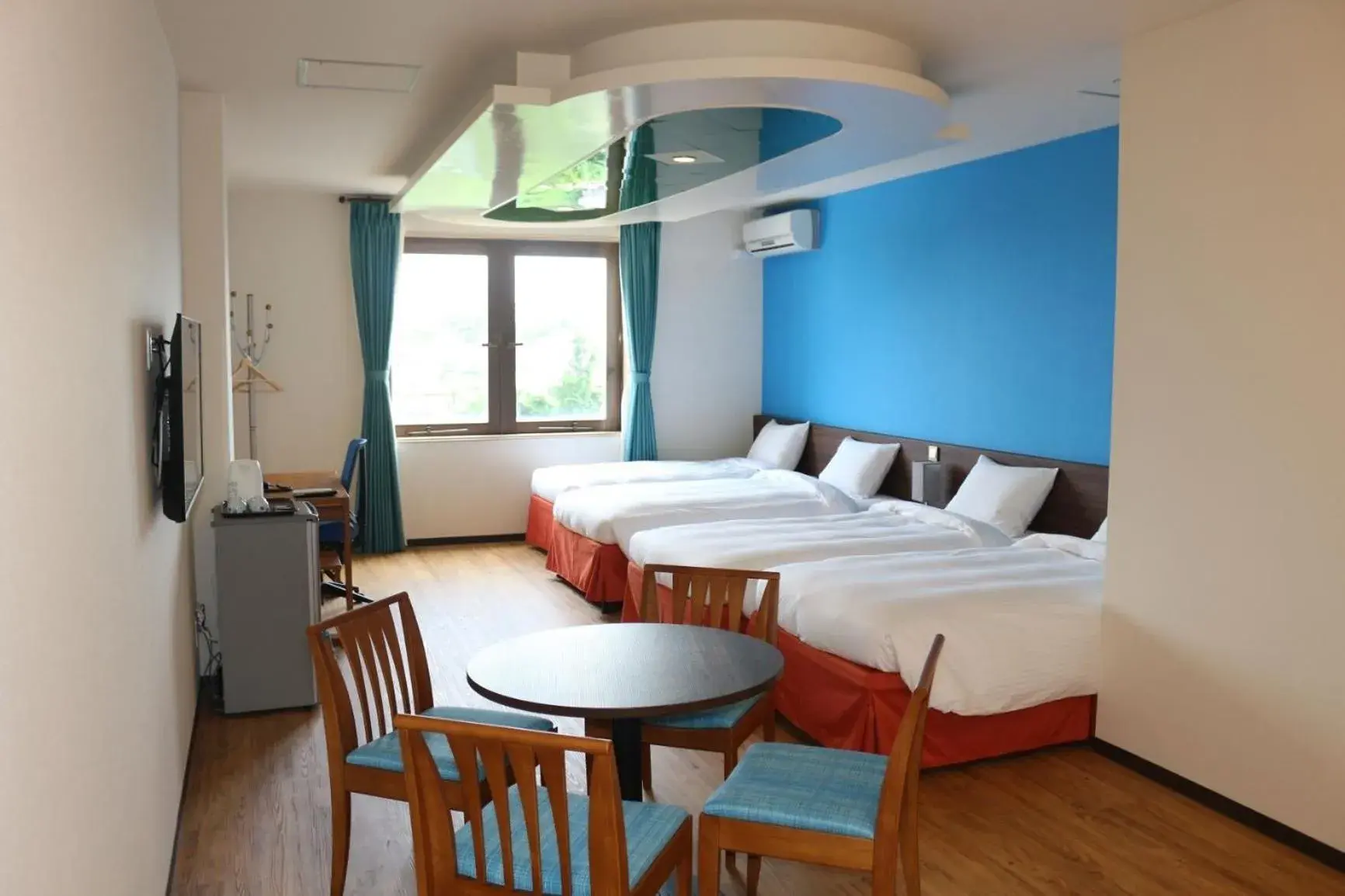 Bed in HiyagunLanaiResort Bed in HiyagunLanaiResort