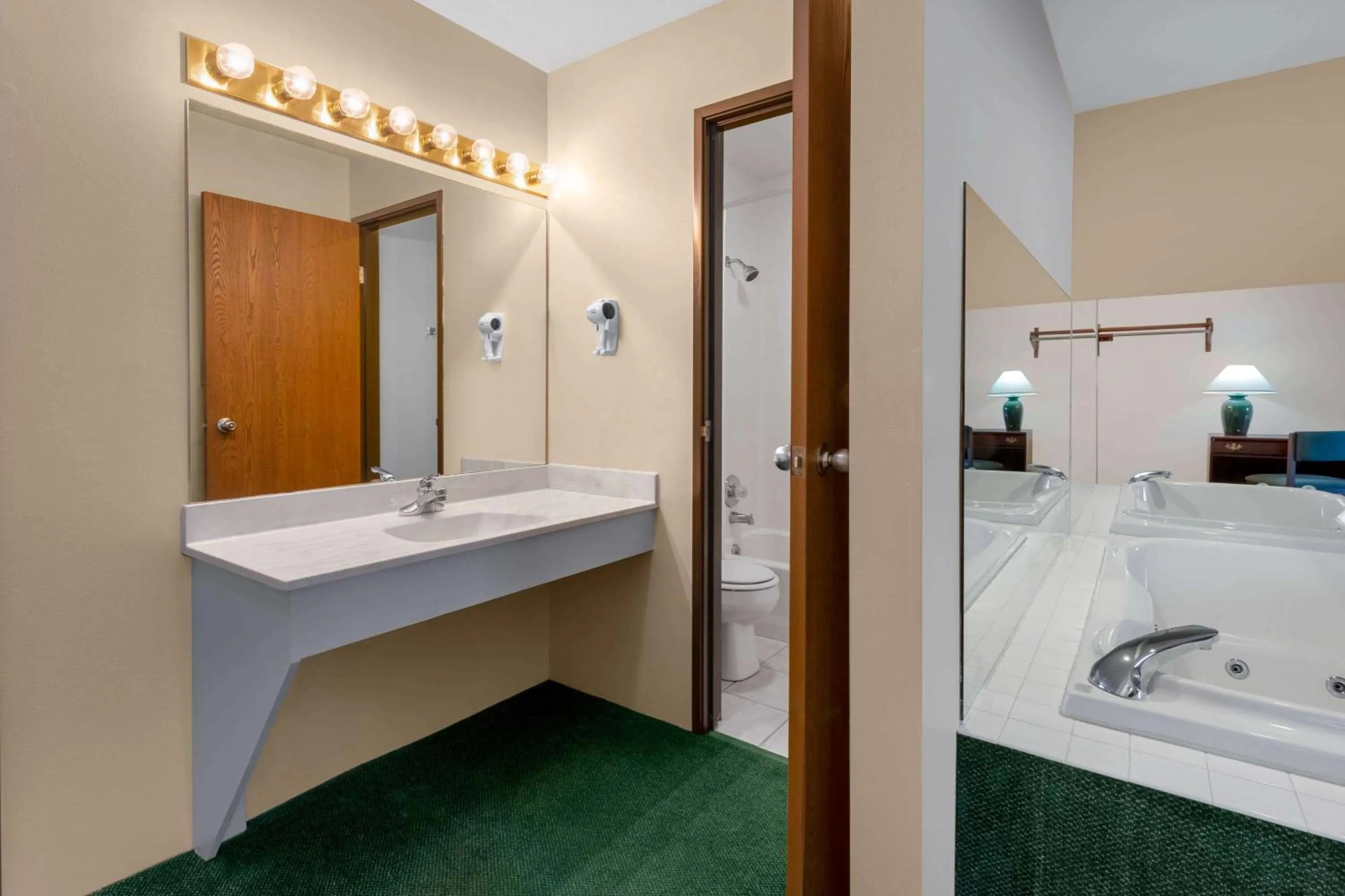 Bathroom in Super 8 by Wyndham Reedsburg