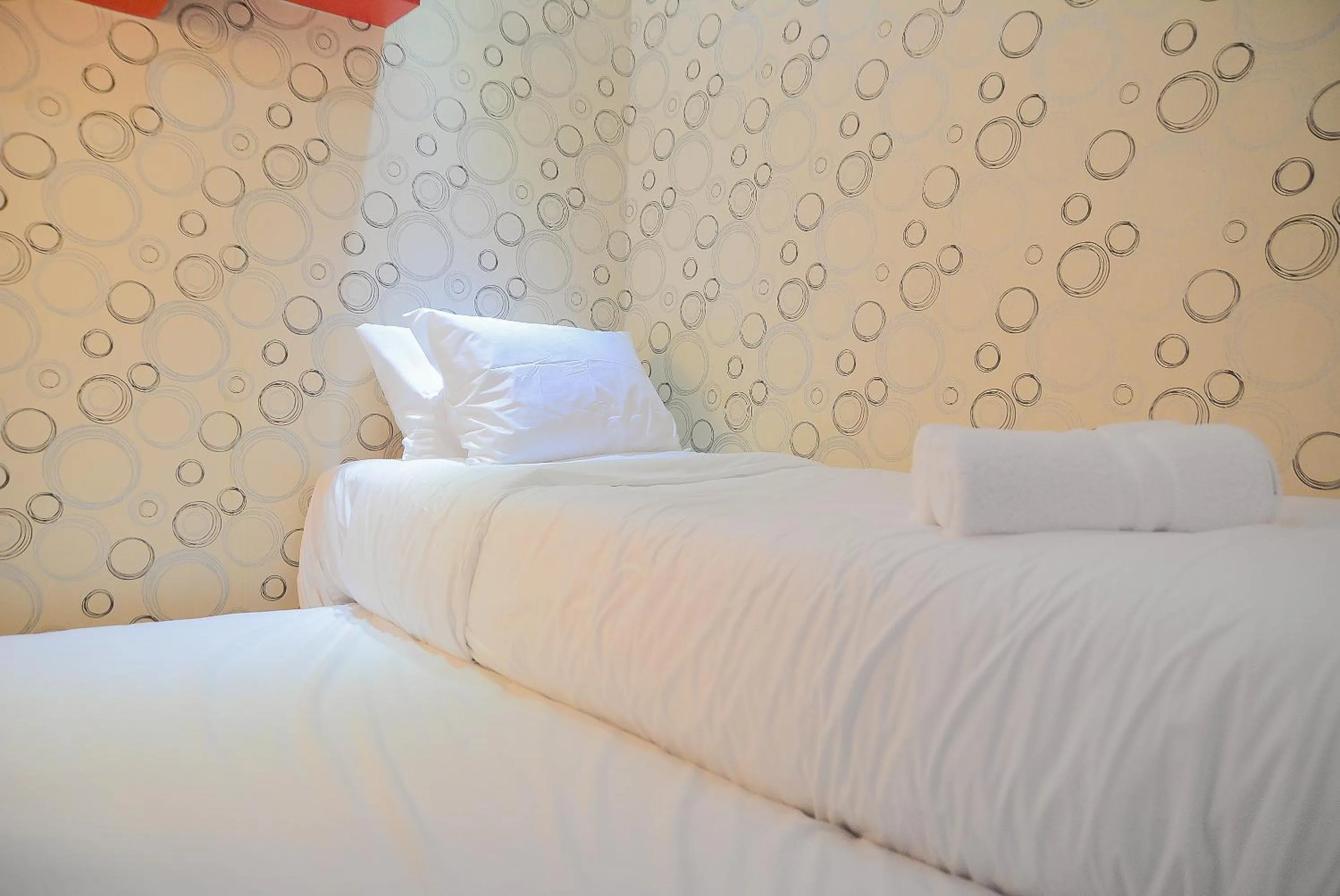 Bed in Homey and Relaxing 2BR Green Pramuka City Apartment By Travelio