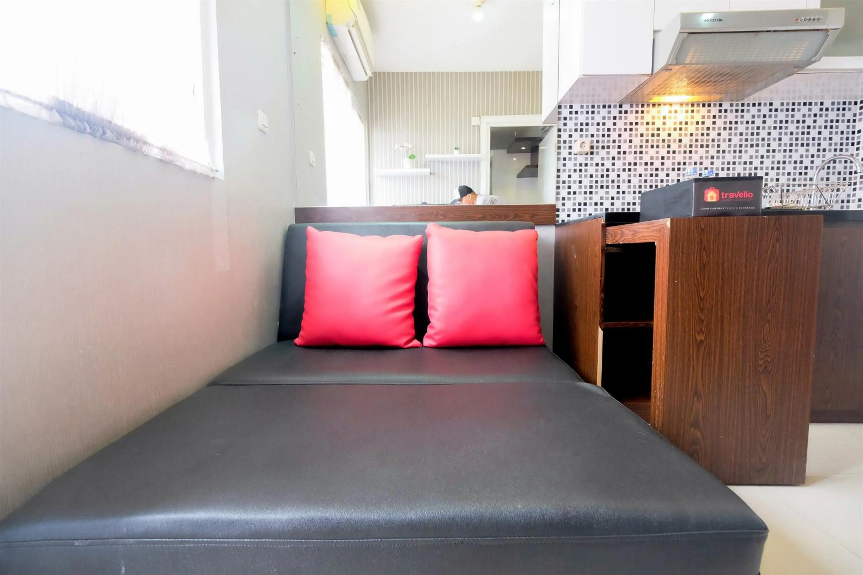 Homey and Relaxing 2BR Green Pramuka City Apartment By Travelio