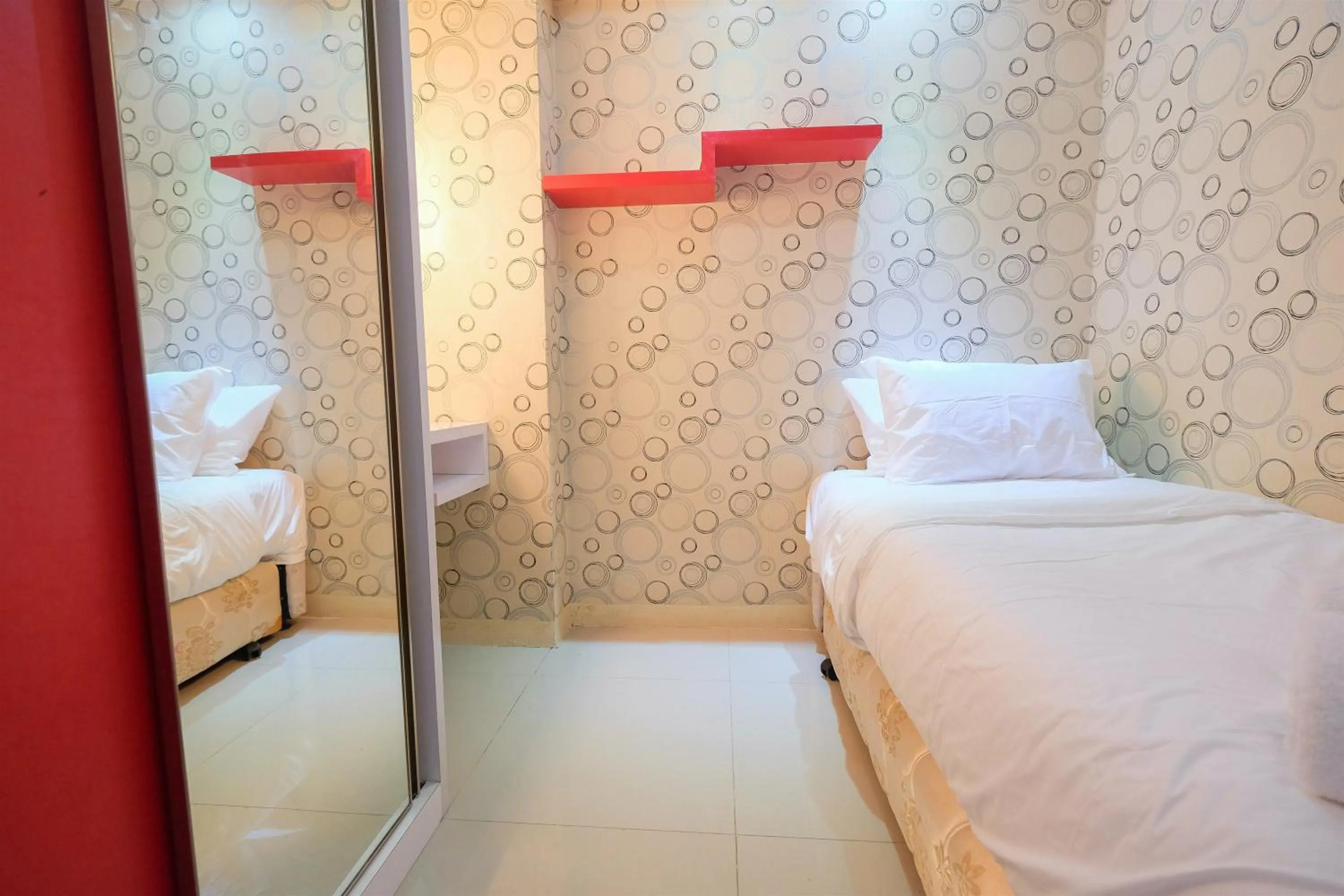 Bed in Homey and Relaxing 2BR Green Pramuka City Apartment By Travelio