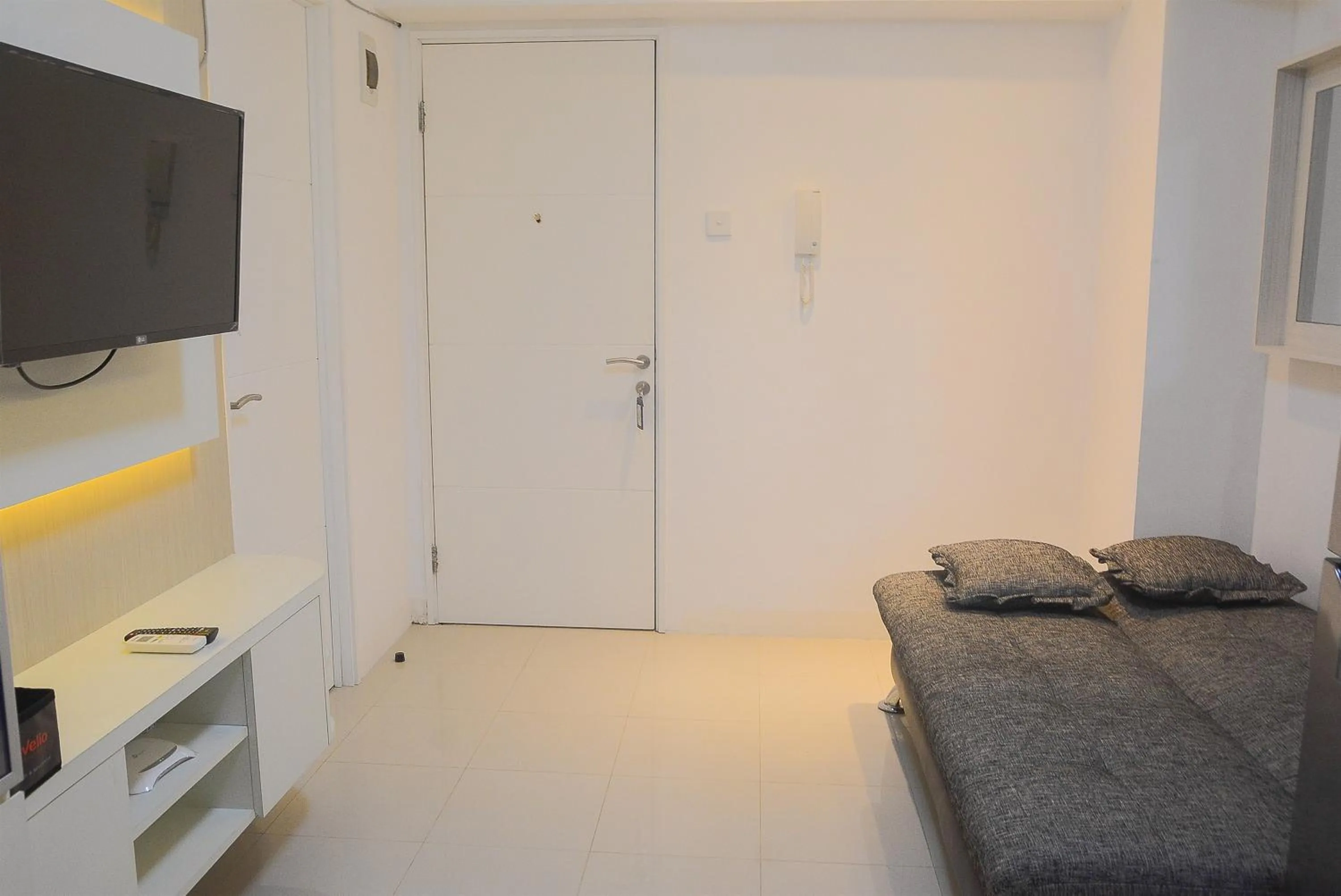Pool View 2BR with Sofa Bed Bassura City Apartment By Travelio