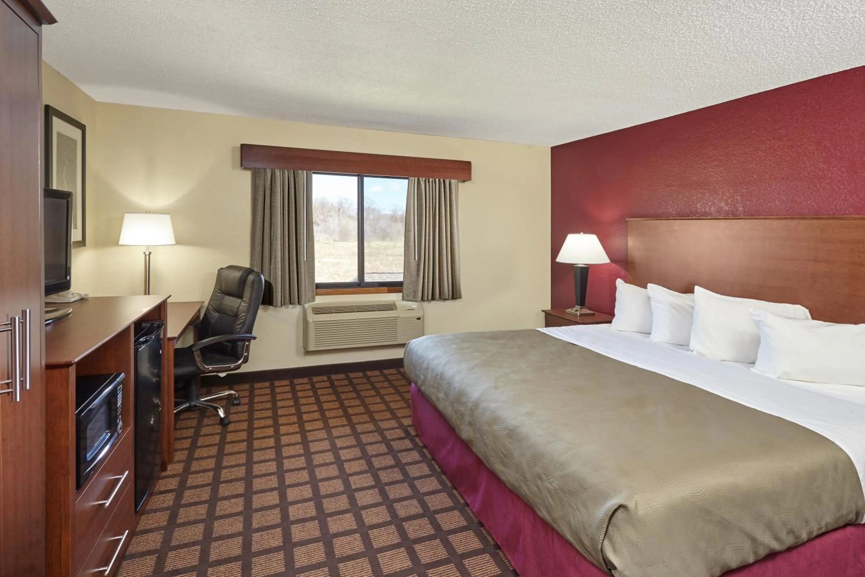 Photo of the whole room, Bed in AmericInn by Wyndham Burlington