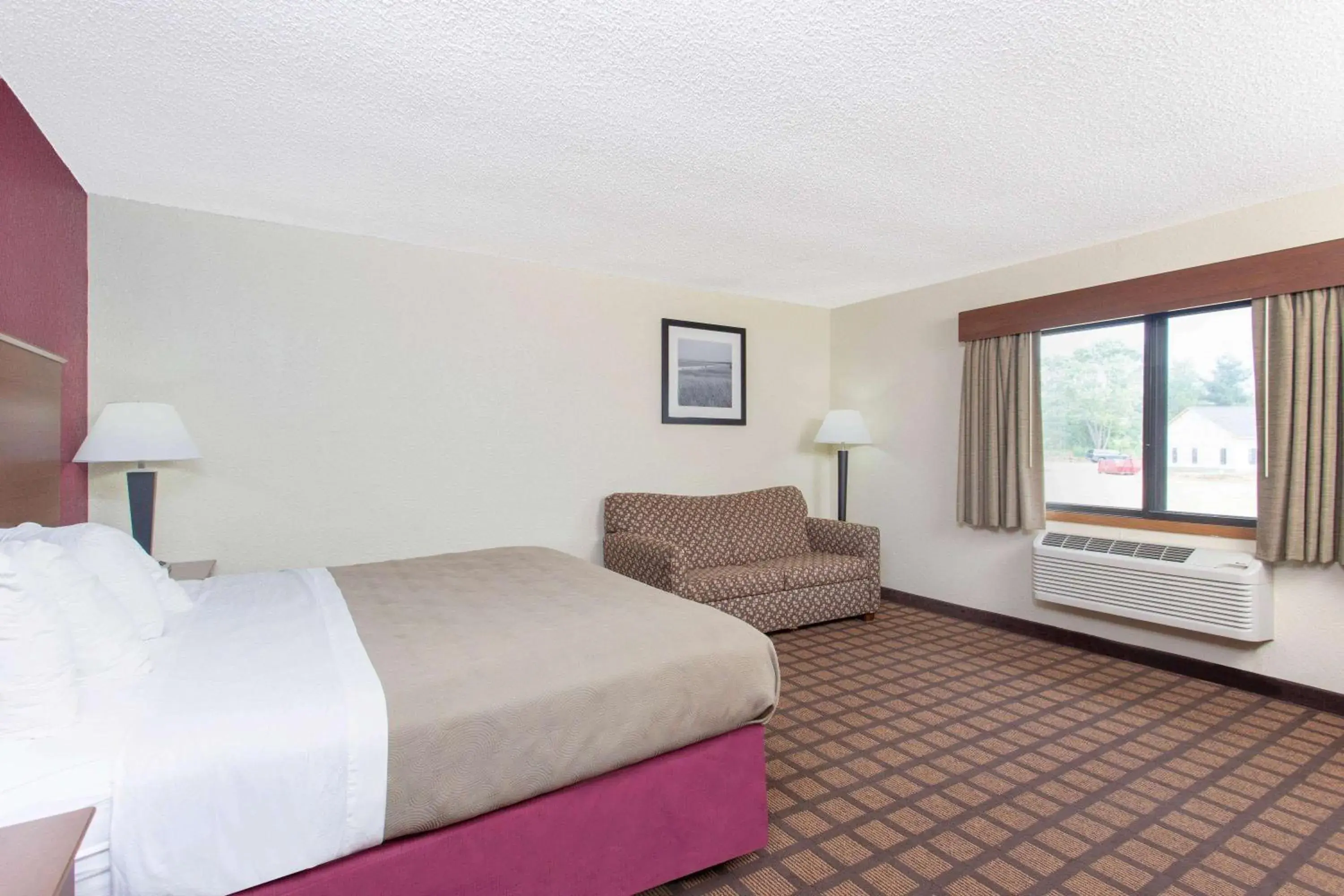 Bed in AmericInn by Wyndham Burlington Bed in AmericInn by Wyndham Burlington